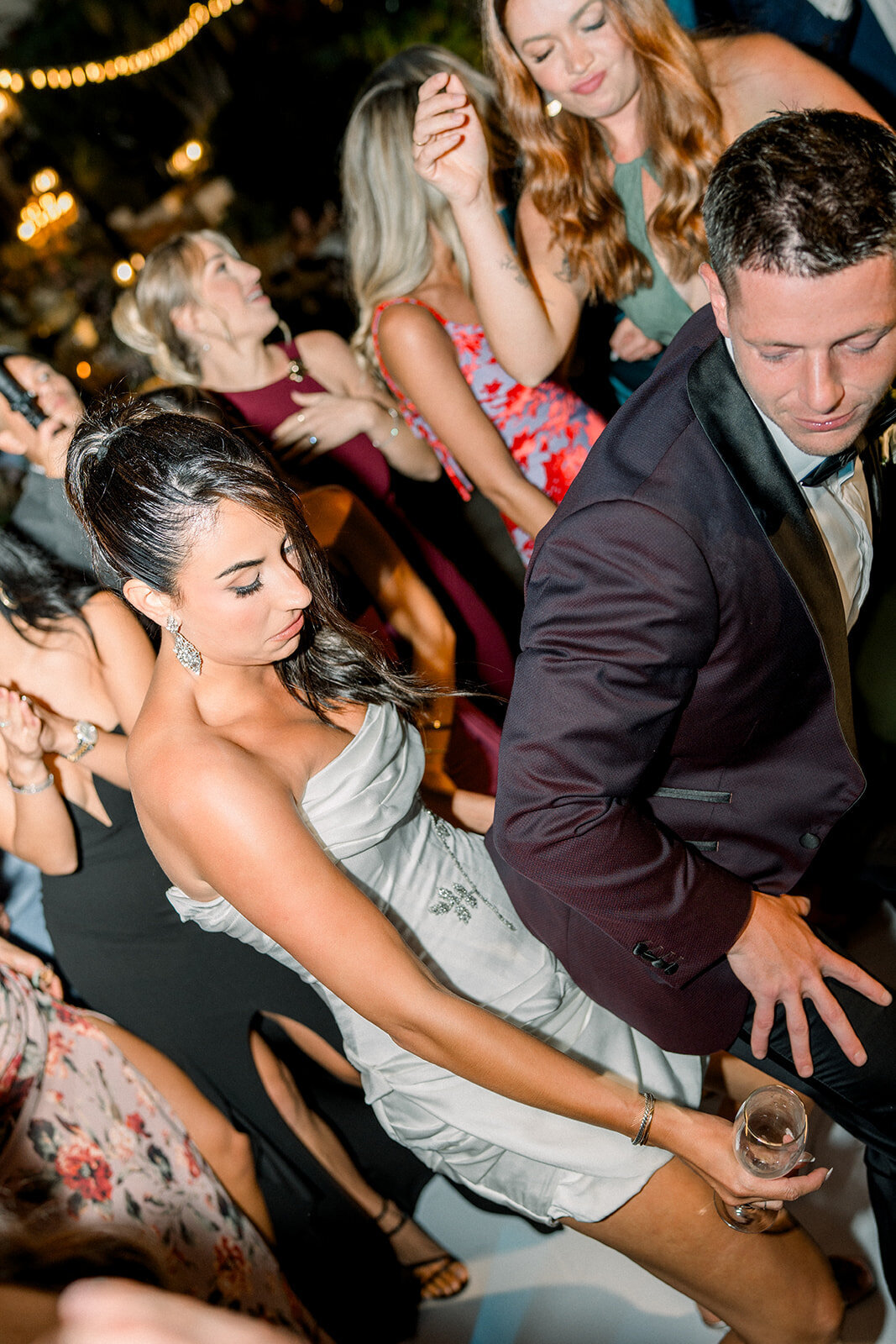 Lively candid moment of bride and groom on the dance floor at their editorial-style reception at Hummingbird Nest Ranch.
