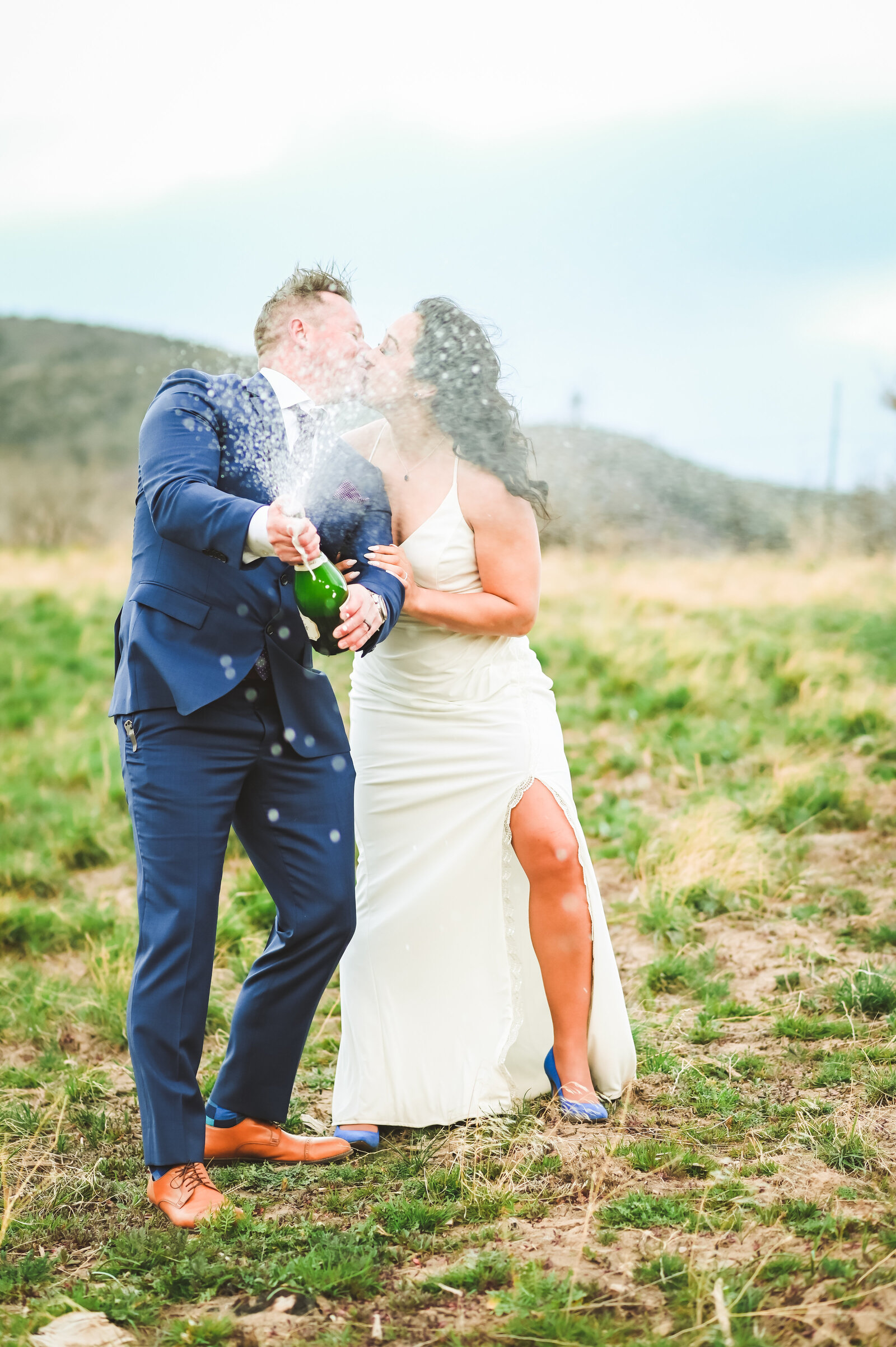Jackson Hole photographers capture couple celebrating with champagne pop