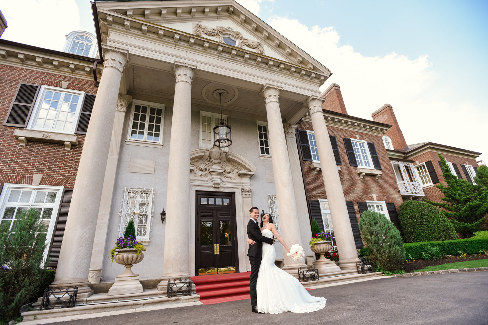 Bride and Groom in front of Glen Cove Mansion