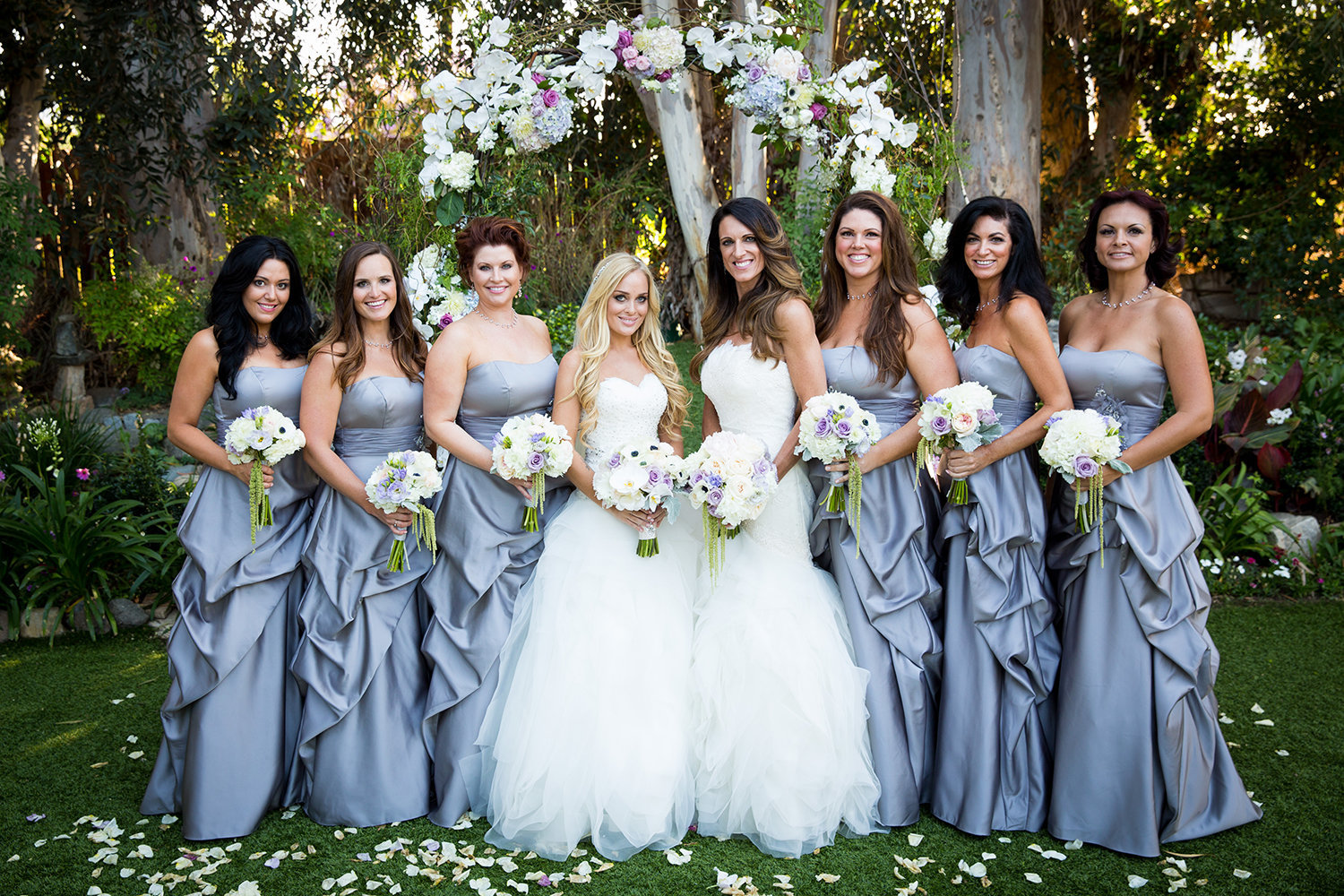 Wedding party along with the beautiful brides at Twin Oaks Garden Estate in San Diego