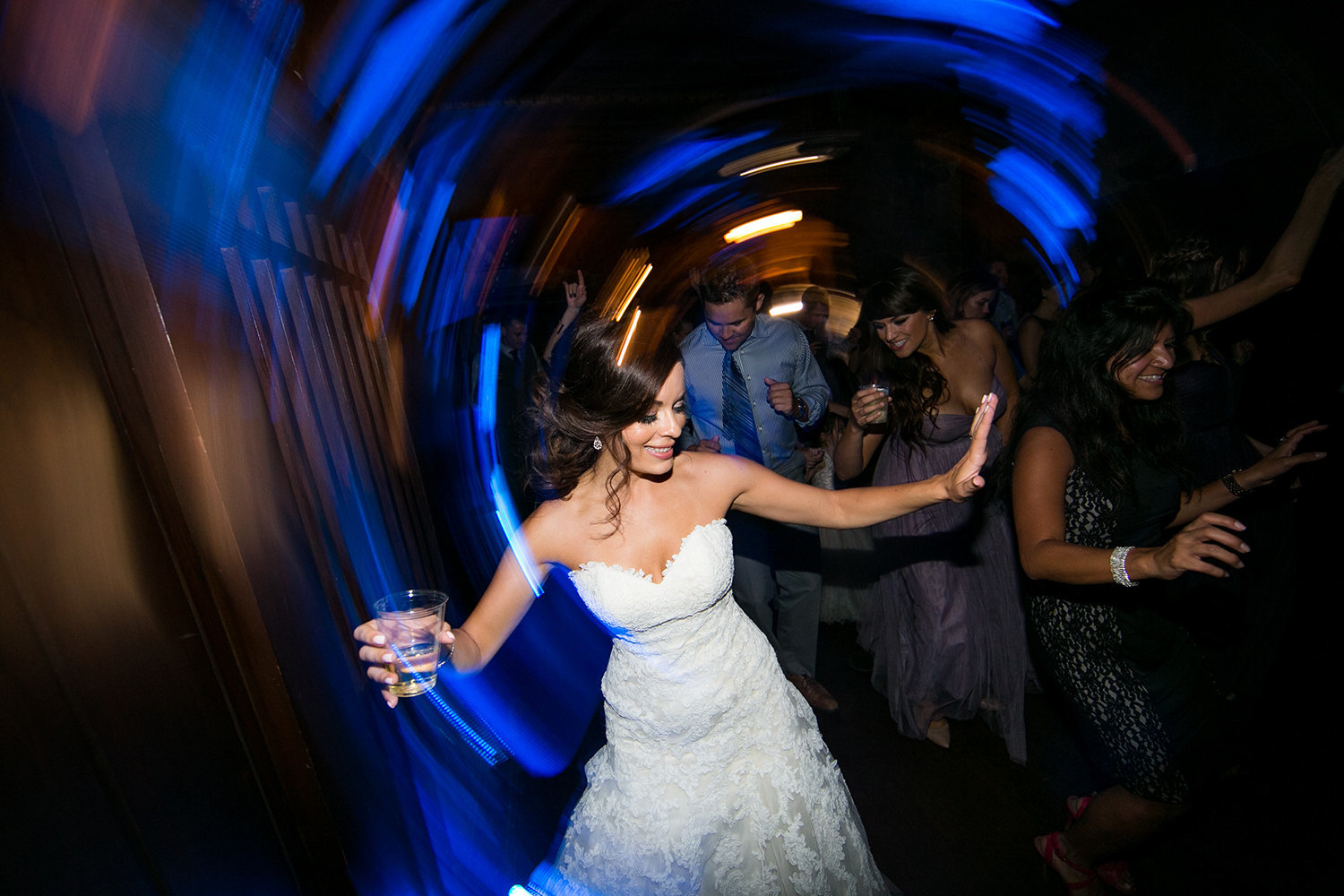 bride dancing with friends at reception