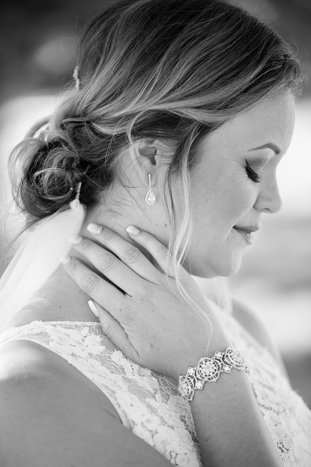 closeup black and white of bride at ocean view room