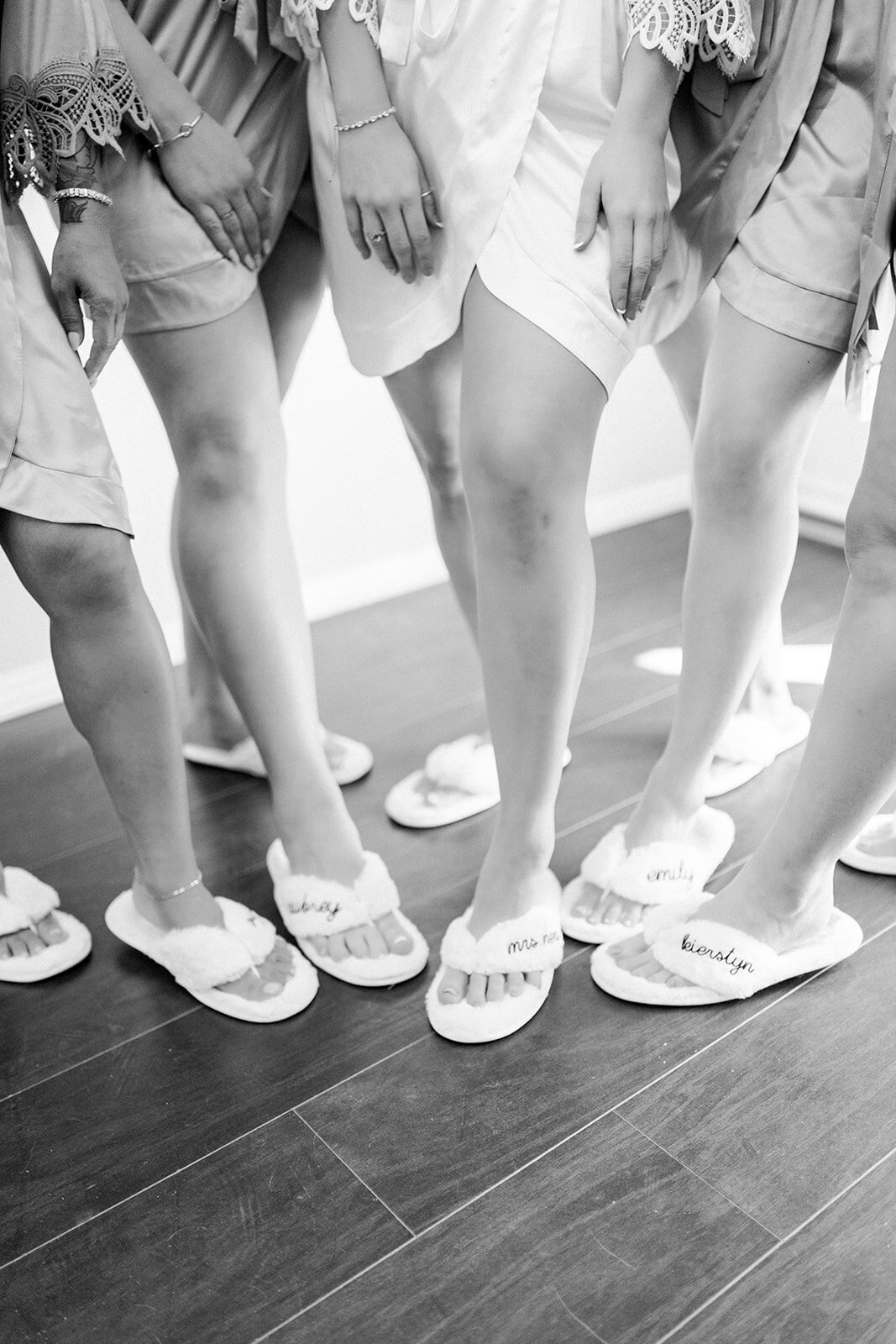 Bride and bridesmaids getting ready slippers at Dolphin Bay Resort in Pismo Beach, CA