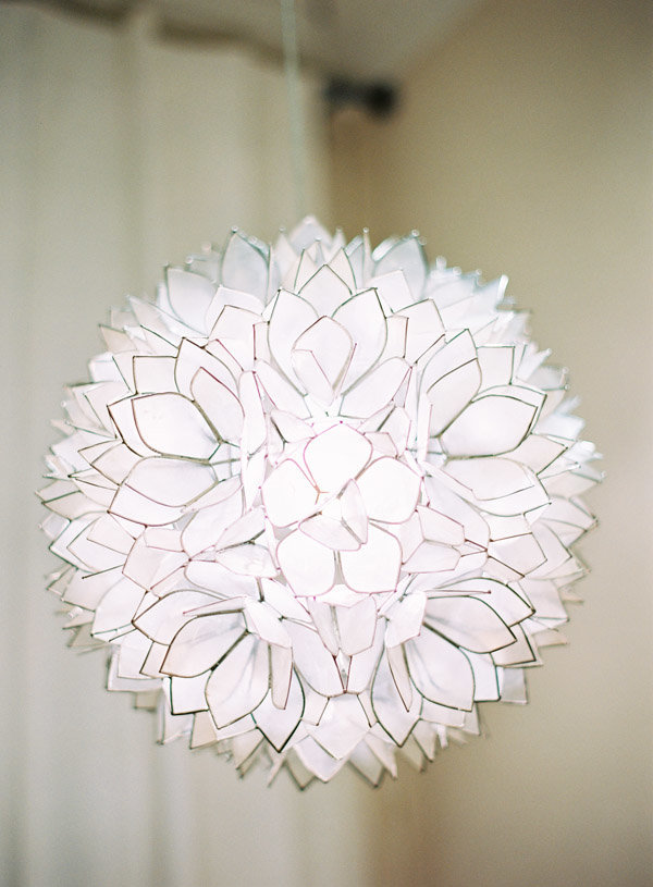 An abstract white petaled lighting fixture.
