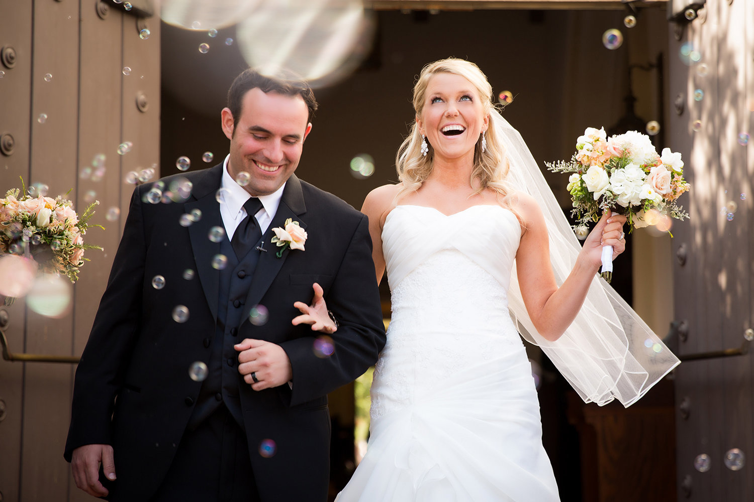 La Jolla Womens Club wedding photos bubbles with couple walking out of ceremony
