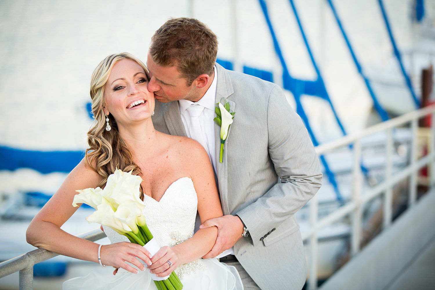 bride laughing with dock in background