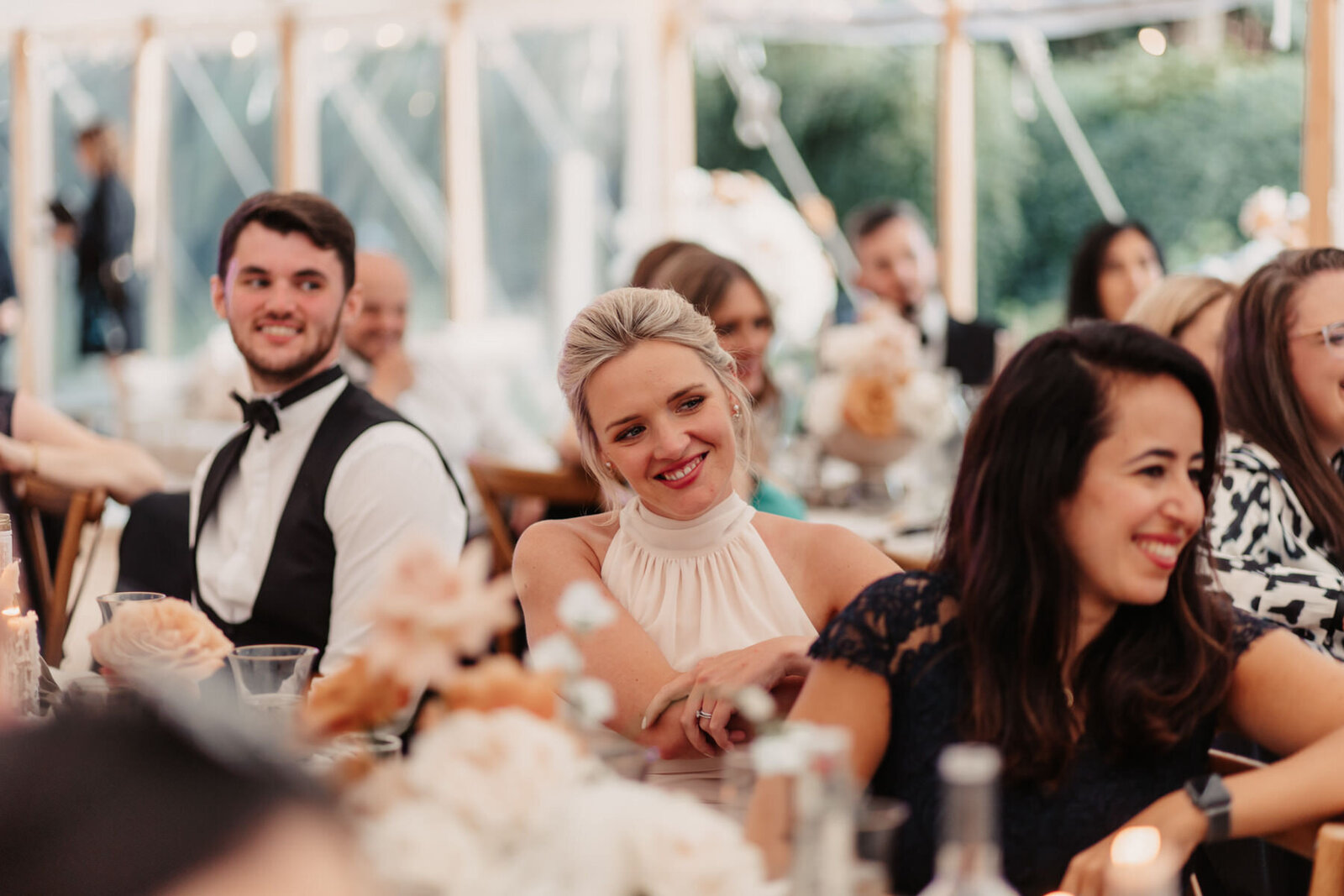 Wedding Guest smiling at reception dinner
