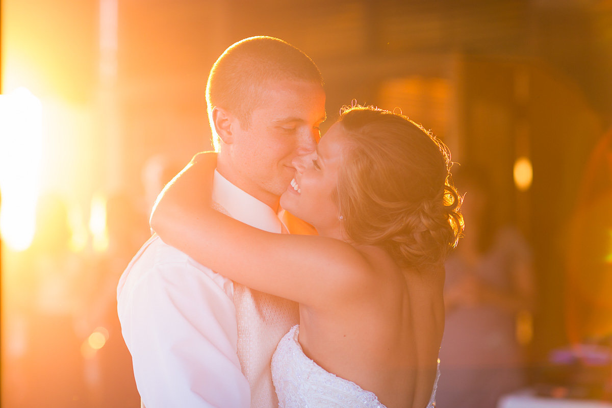 sunset image of couple by a husband and wife at a wedding