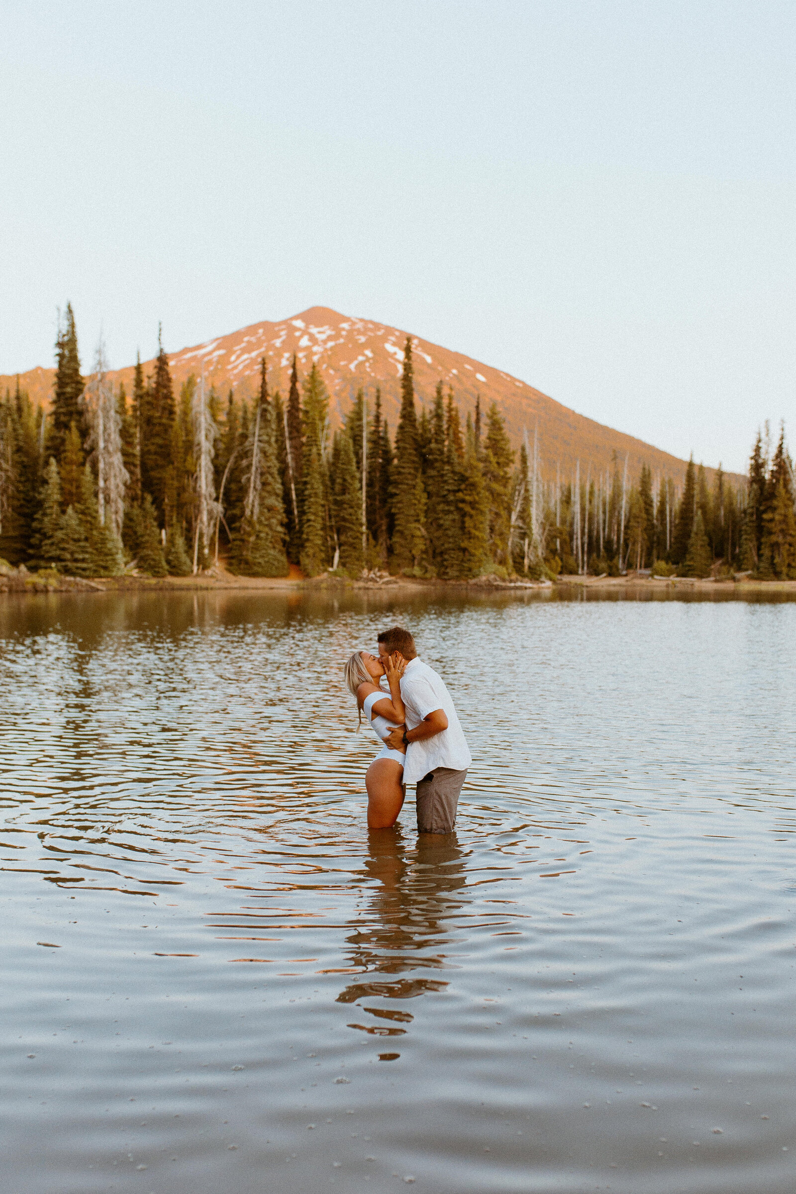 couple holding eachother in the water
