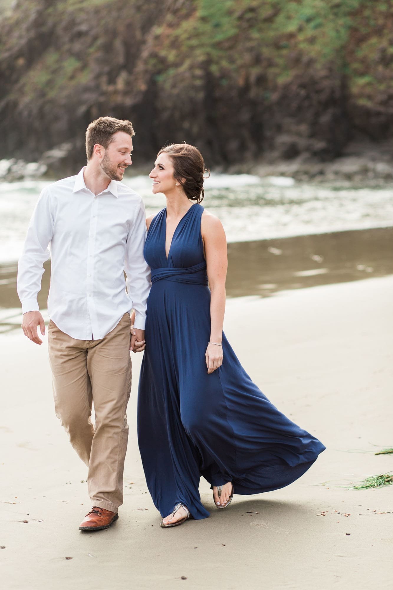 Wind blows dress during engagement session at Ecola State Park
