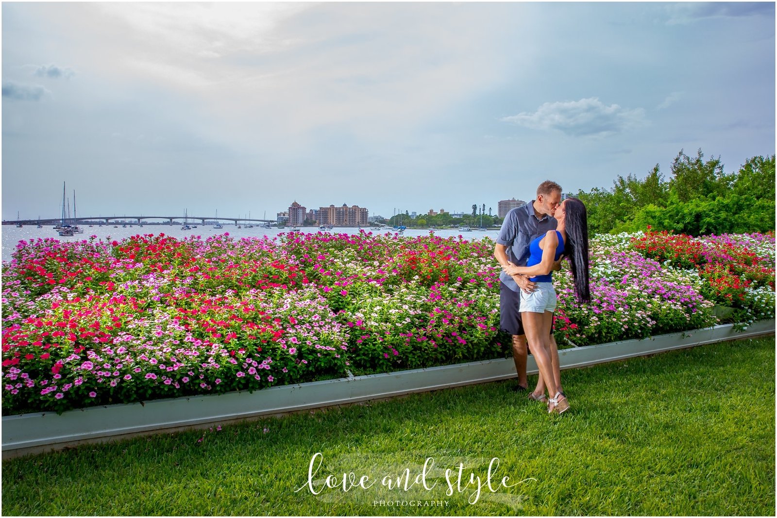 Engagement Photography at Selby Gardens in front of the flower beds with couple embracing and kissing