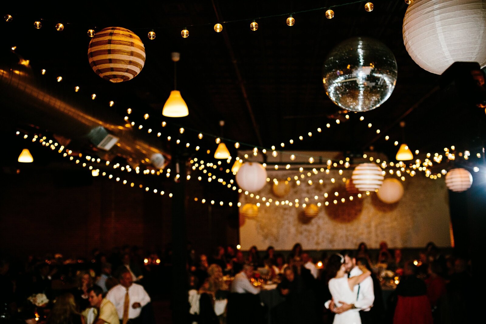 Bride and groom take their first dance as a married couple