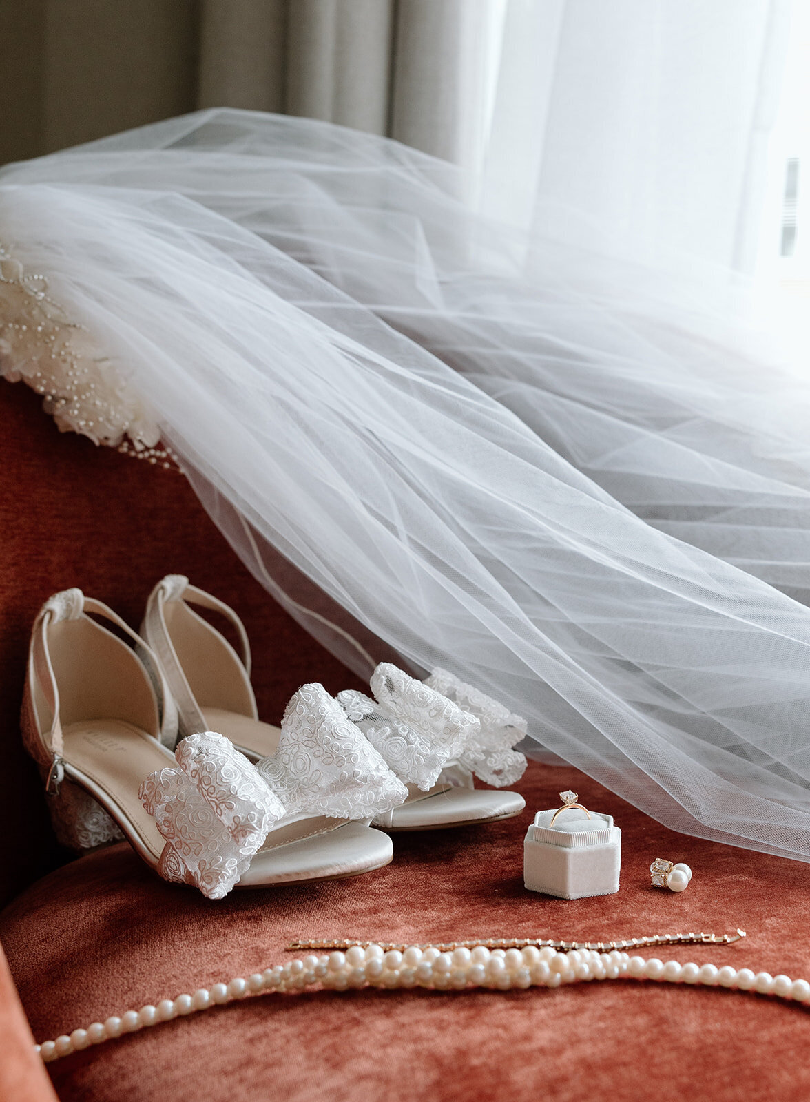 Wedding detail photography with veil, ring and shoes