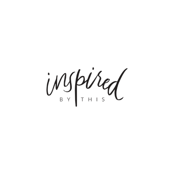 The word "Inspired" written in cursive and black lettering.