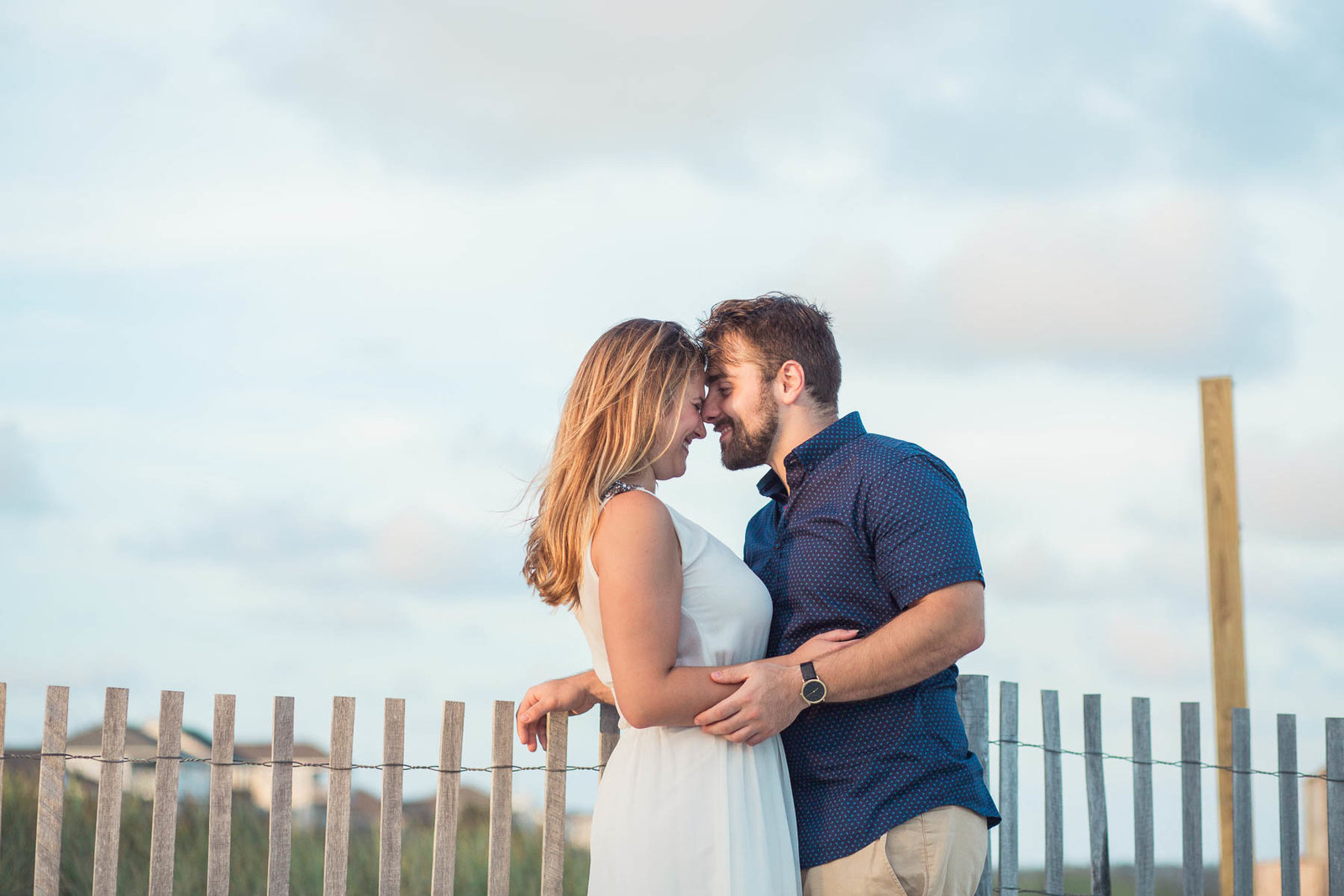 Engaged Couple by the dunes at sunset, Folly beach in Charleston, South Carolina