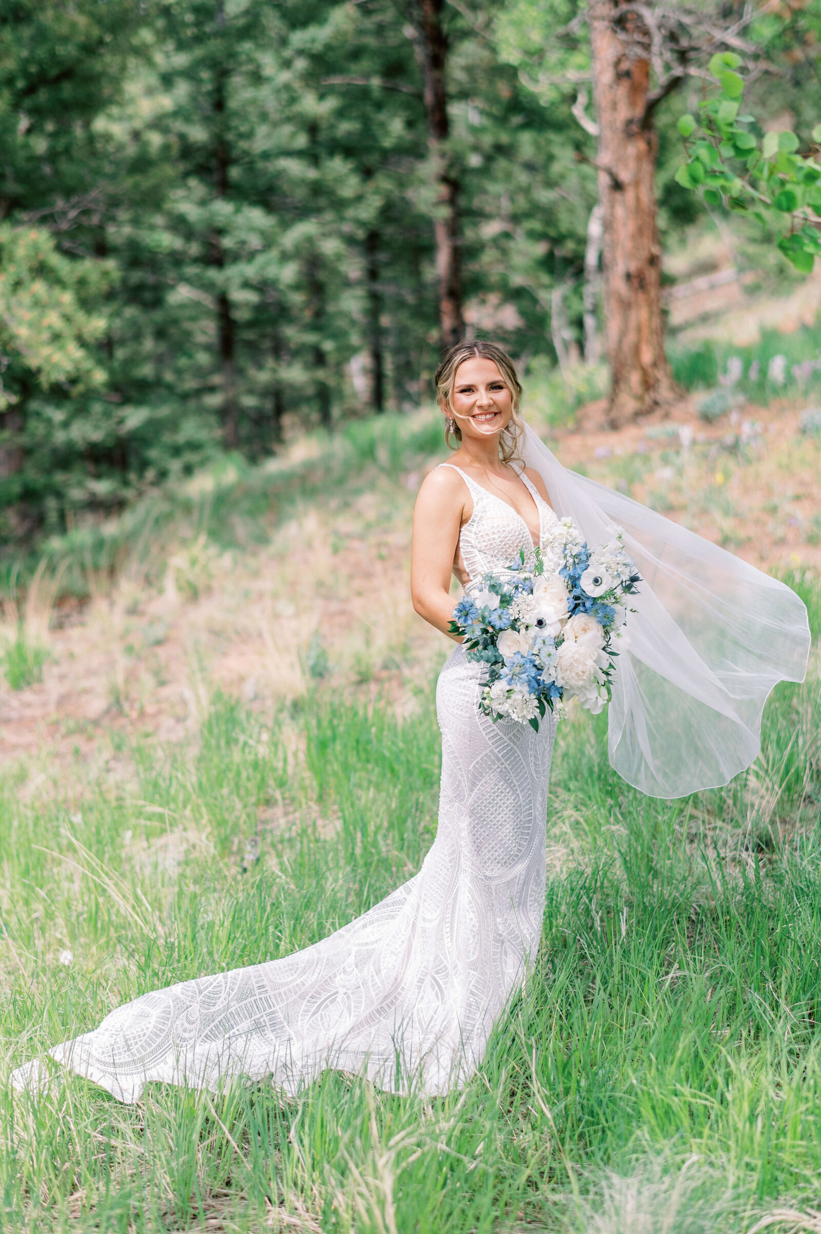 Beautiful bride smiles at the camera of Virginia wedding photographer during her bridal portraits