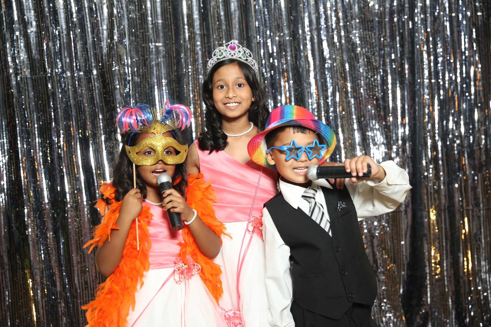Children wearing props in photobooth. Photo by Ross Photography, Trinidad, W.I..