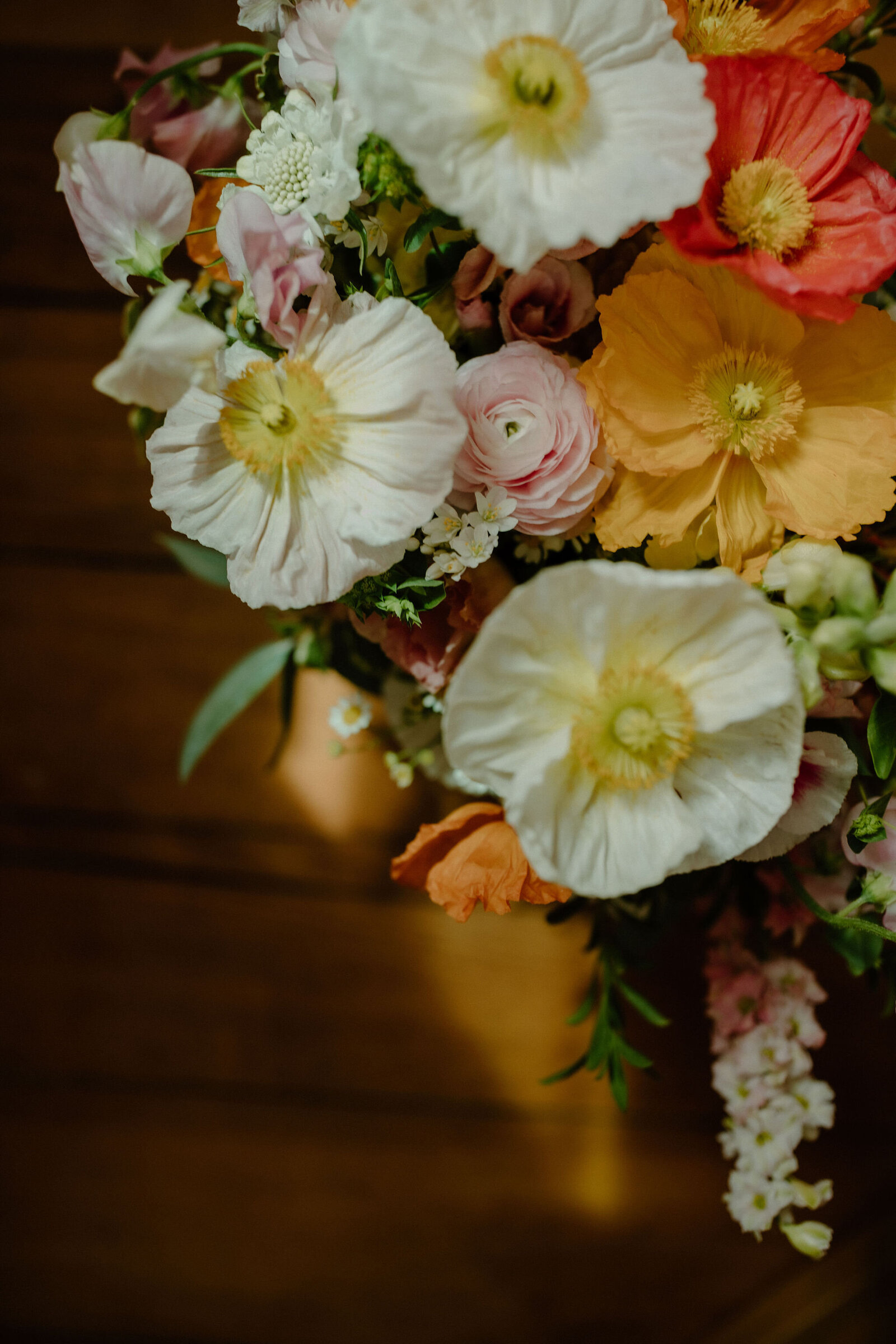 wedding floral details featuring white, yellow, pink, orange, coral flowers