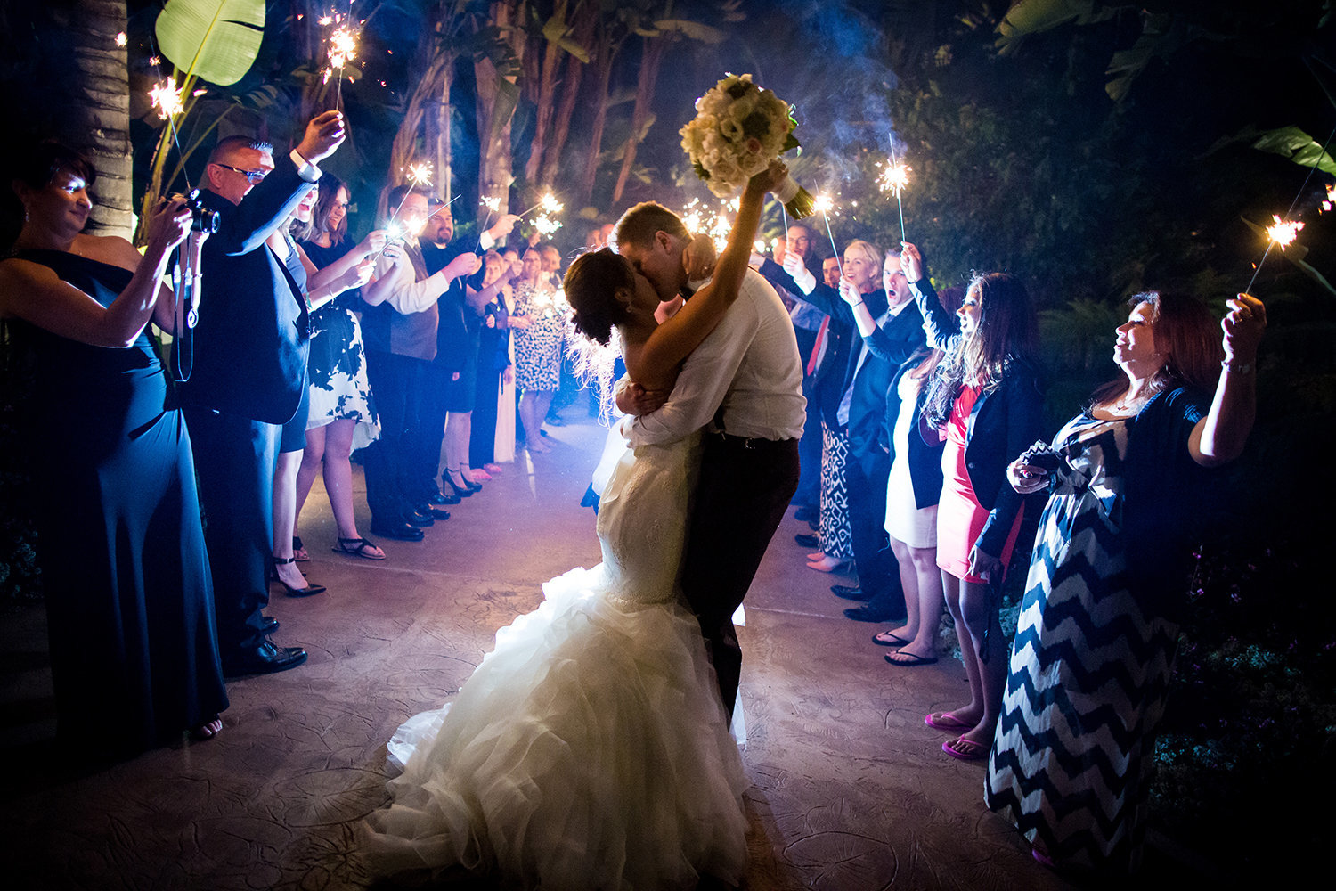 Amazing grand exit photo with sparklers of the bride and groom