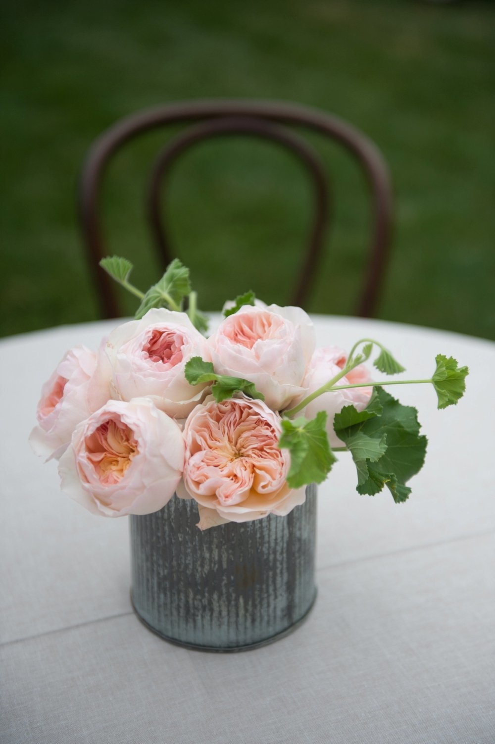 Blush garden roses cocktail table centerpiece at The Barn on Walnut Hll