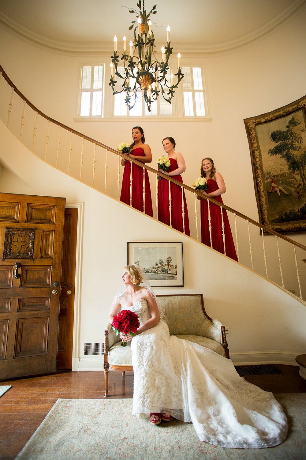 bride with bridesmaids on stairs at darlington house