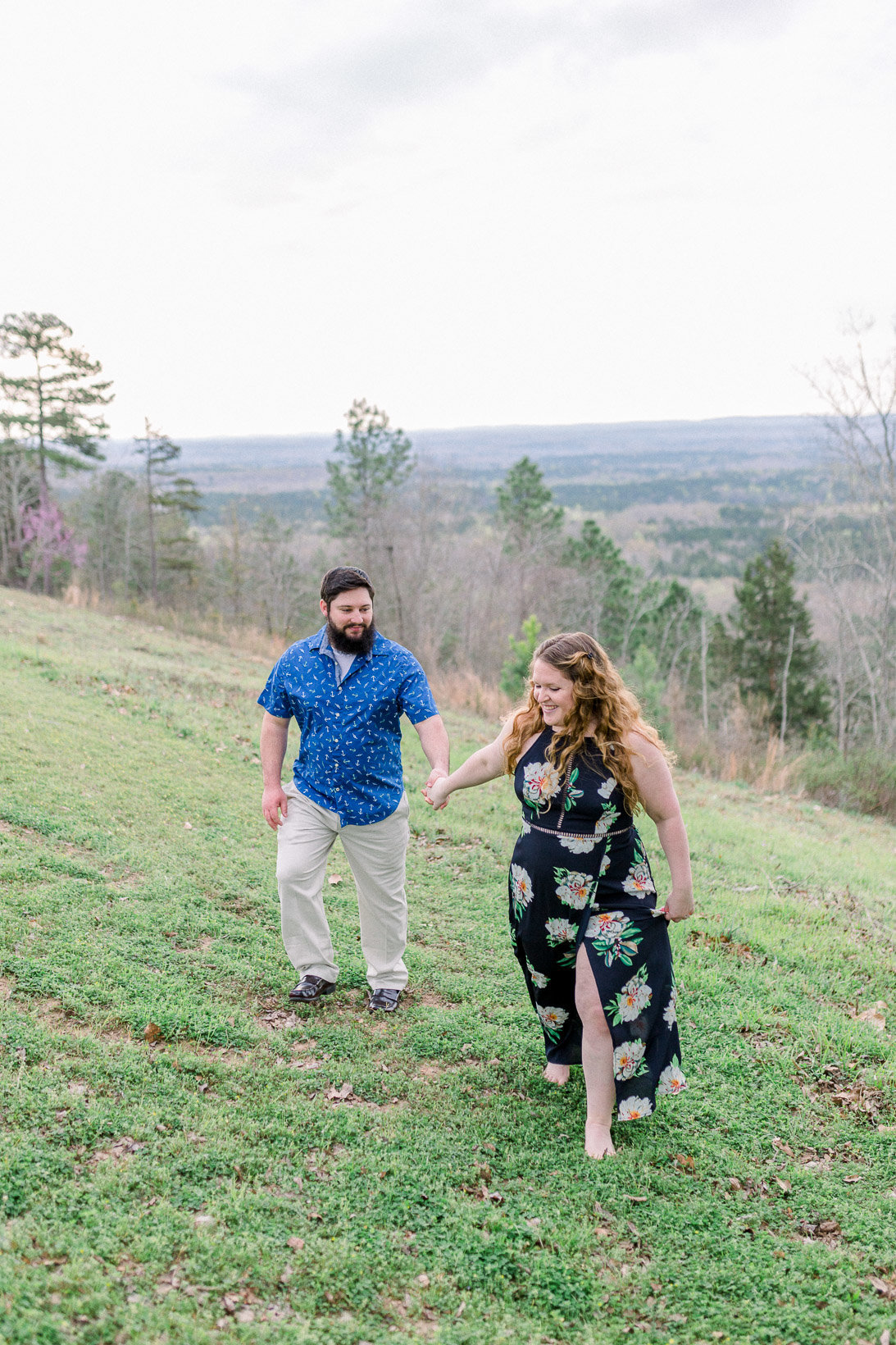 Couple holding hands and laughing captured by Staci Addison Photography