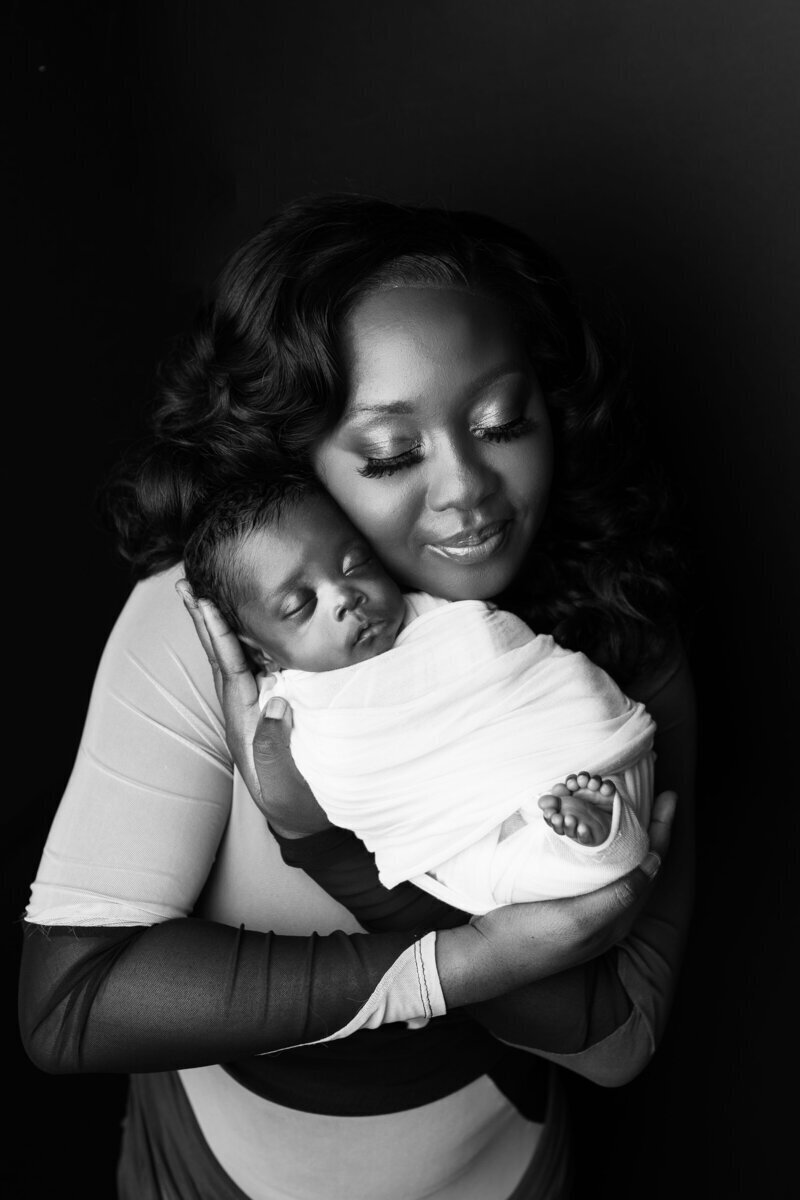 Mom with newborn baby taken by best newborn photographers nj
