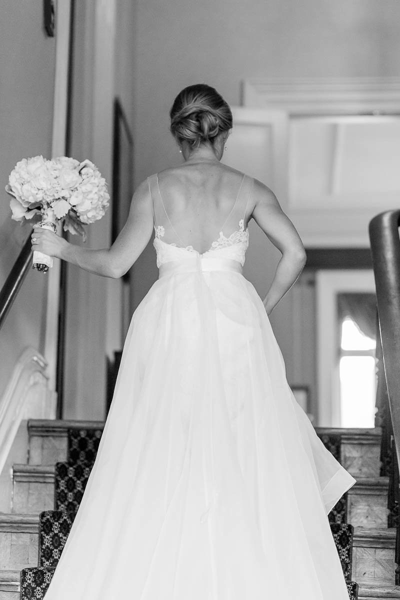 Bride walks up the stairs, John Rutledge House Inn, Charleston Wedding Photographer.
