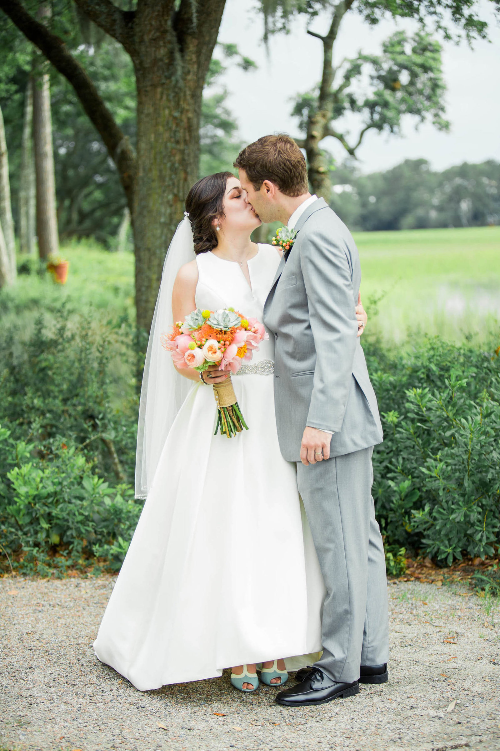 Bride and groom stand by the marsh, I'on Creek Club, Mt Pleasant, South Carolina
