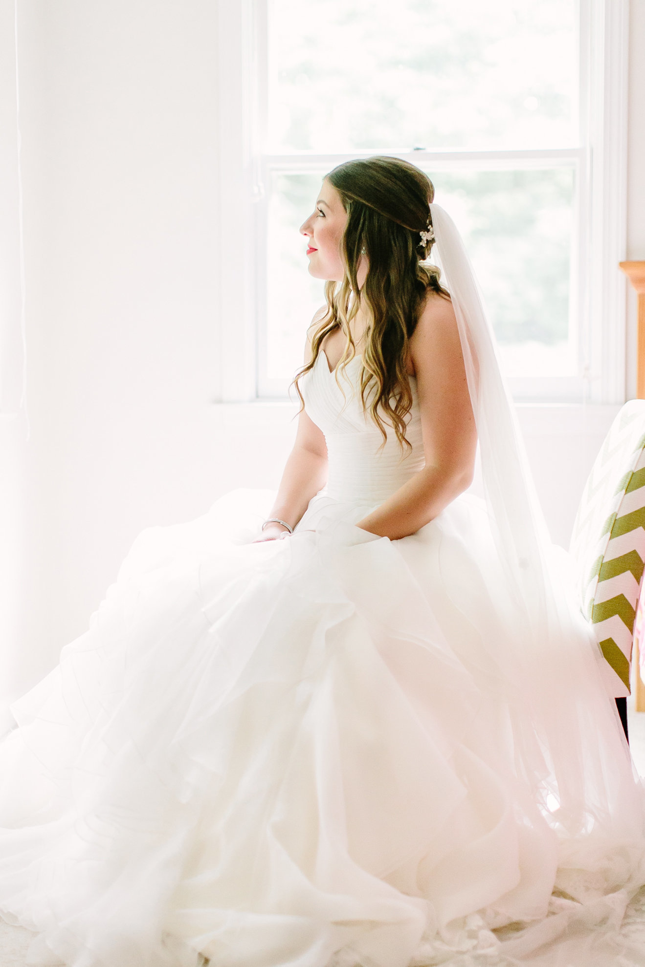 bride seating looking outside her window in Rye NY