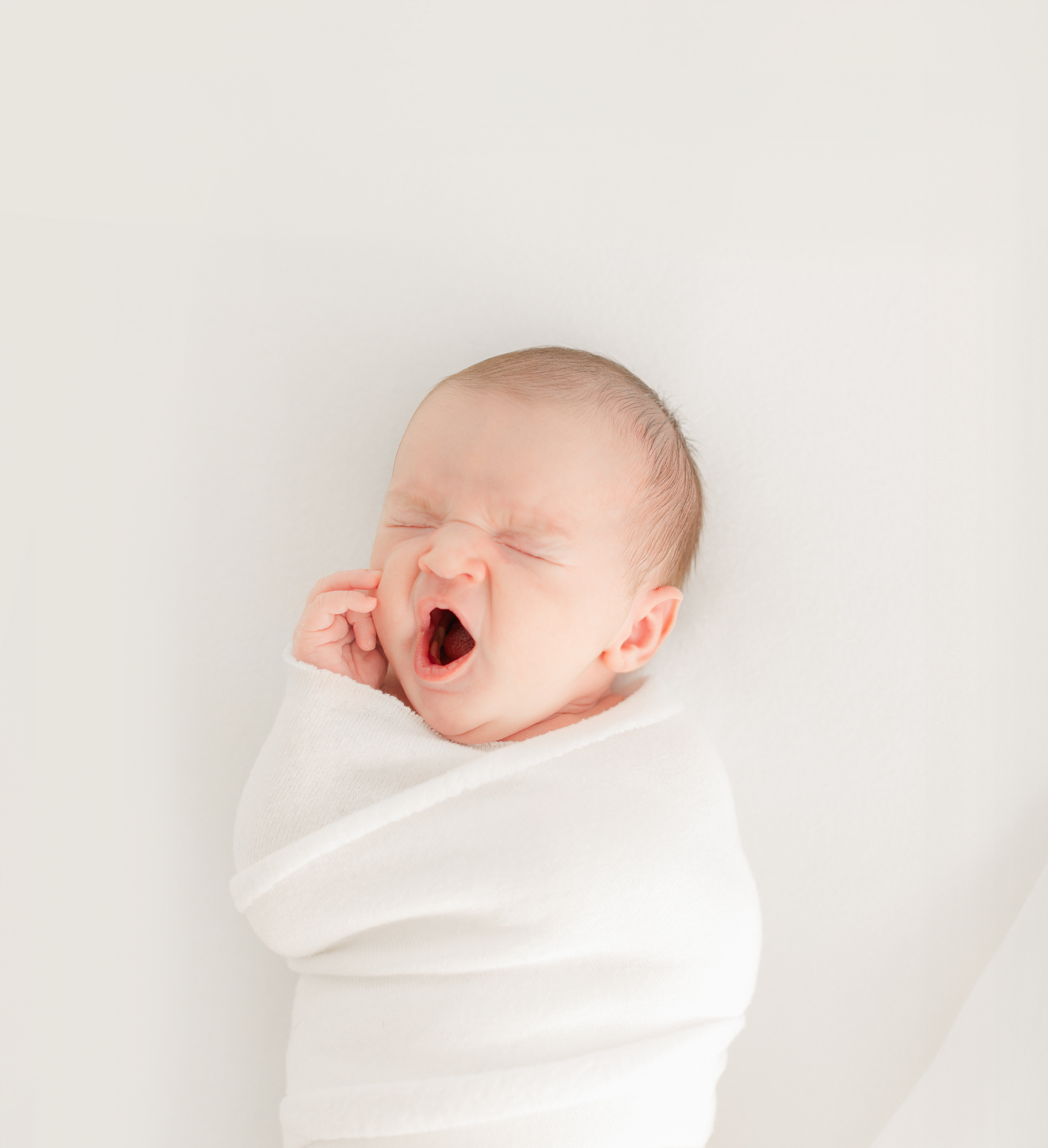 baby yawns during massachusetts newborn photography session