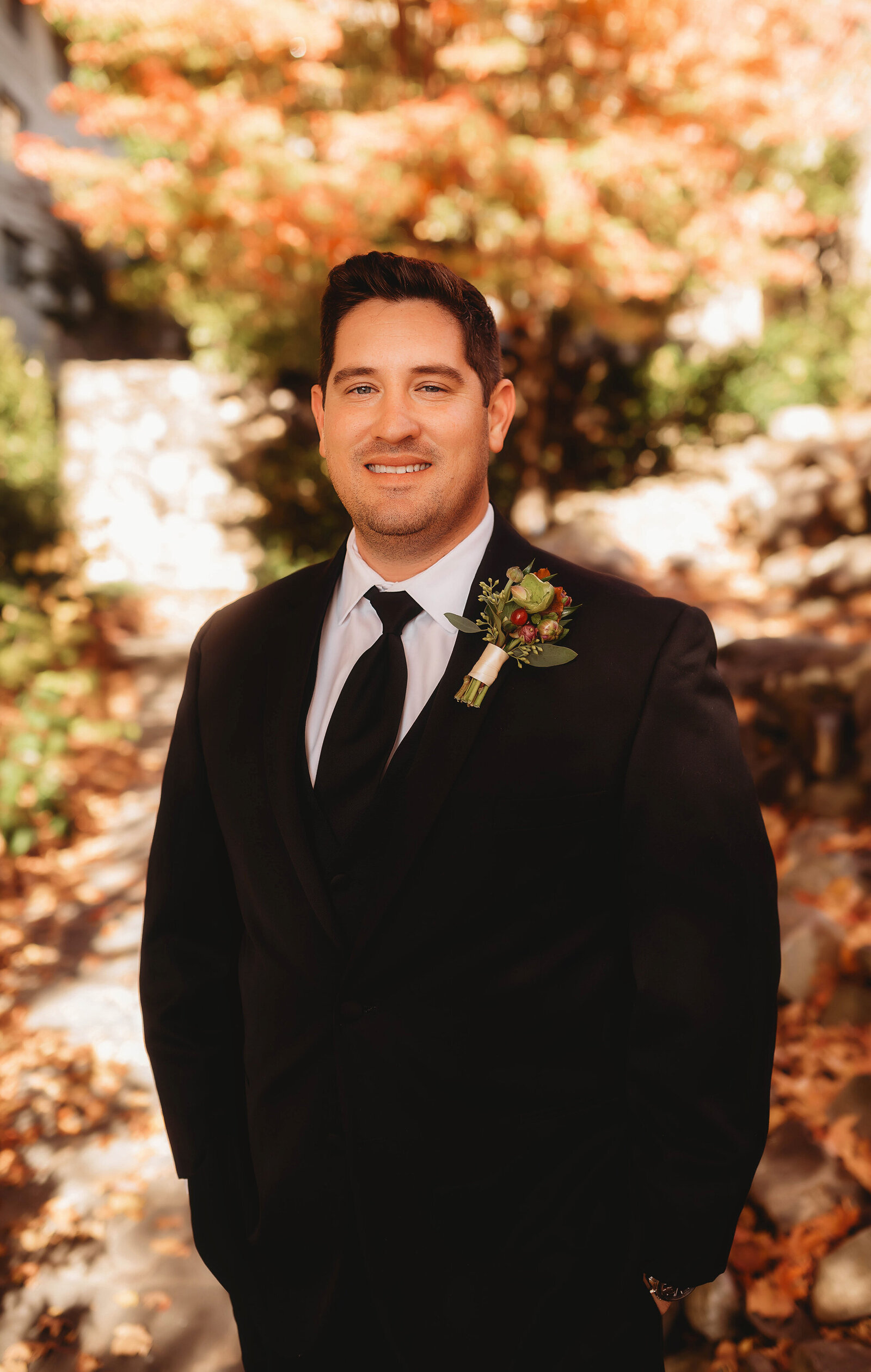 Groom poses for portraits before his Elopement Ceremony at Grove Park Inn in Asheville, NC.