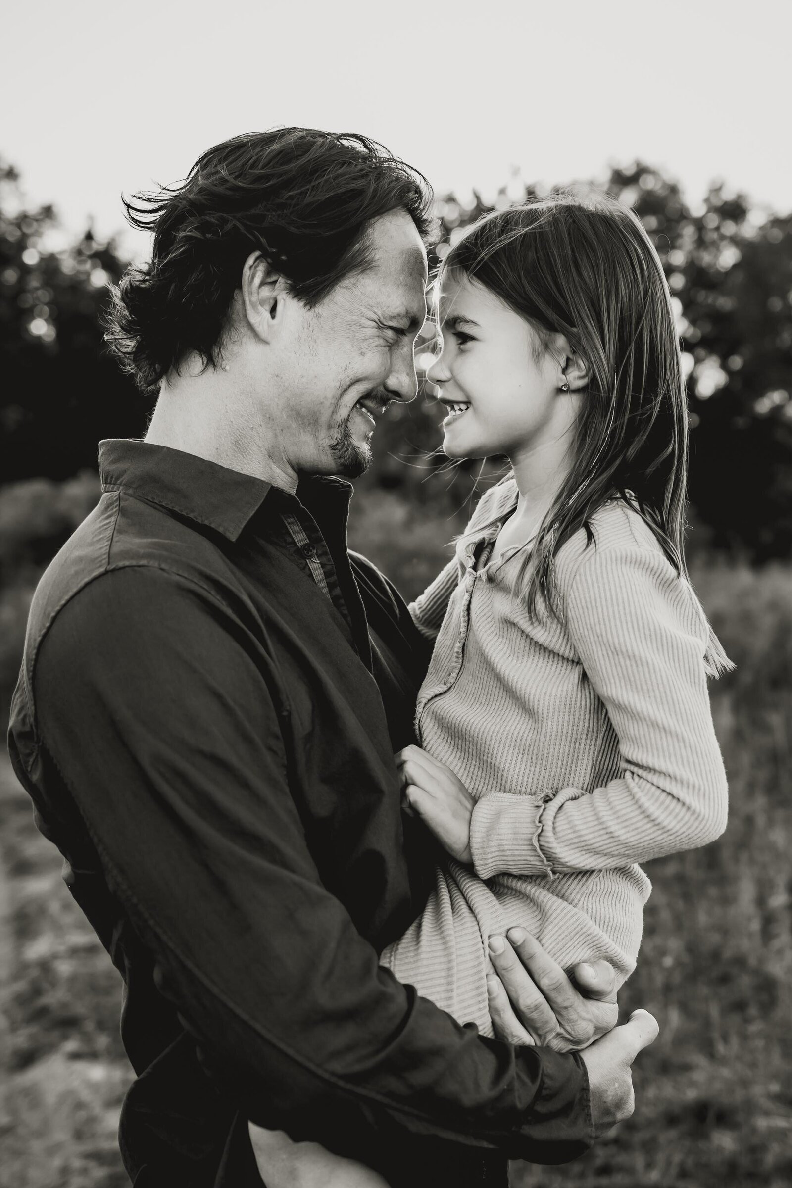 father and daughter form Southlake Texas embrace and laugh