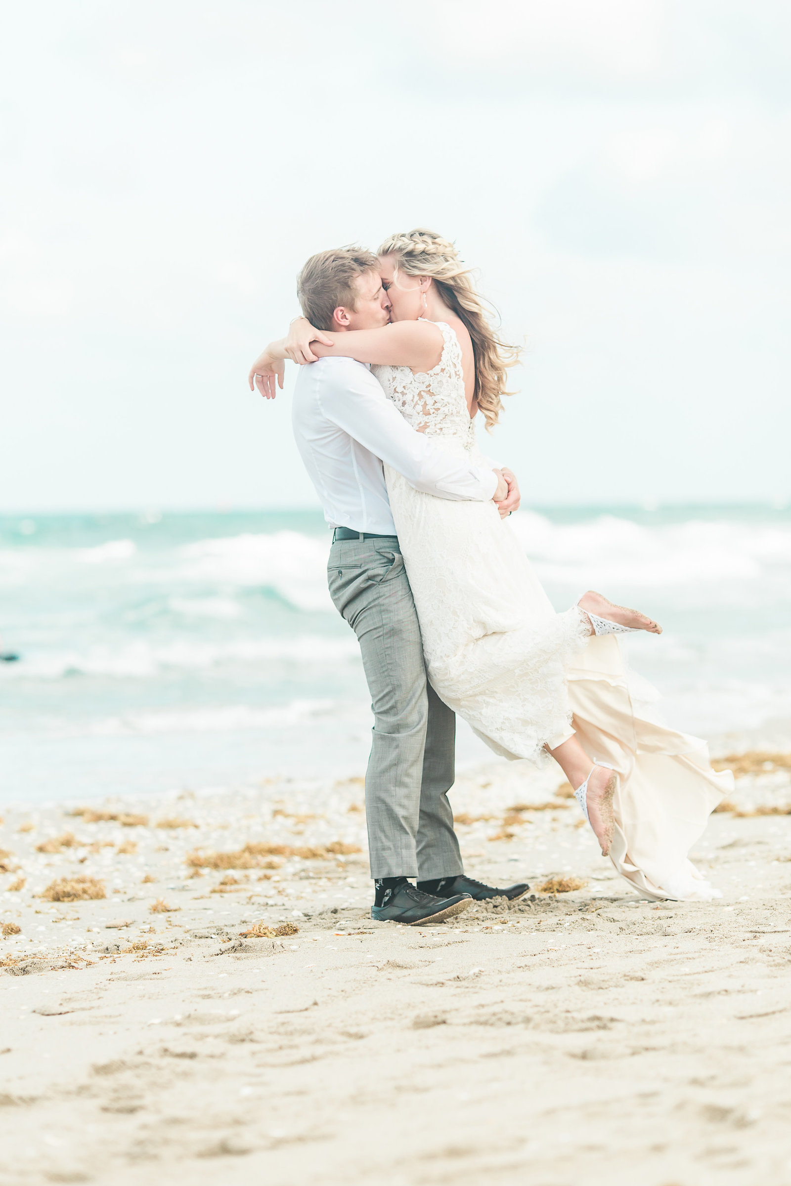 Beach Kiss Wedding Couple- Hilton Singer Island Wedding - Palm Beach Wedding Photography by Palm Beach Photography, Inc.