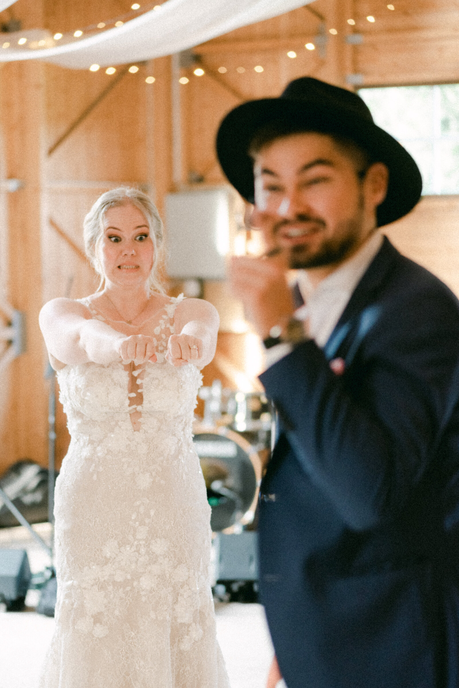 A magician doing a magic trick with the bride at the wedding in an image photographed by wedding photographer Hannika Gabrielsson.