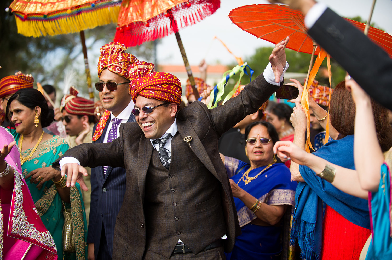 Family of the groom celebrates during the Baraat