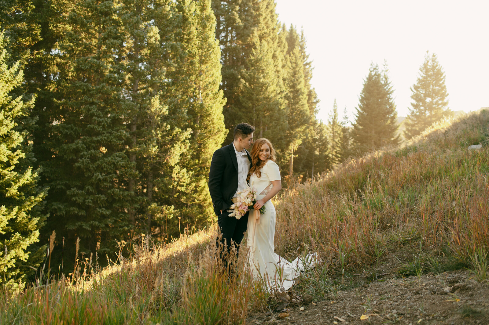 A wedding couple on the side of a hill in Crested Butte, California