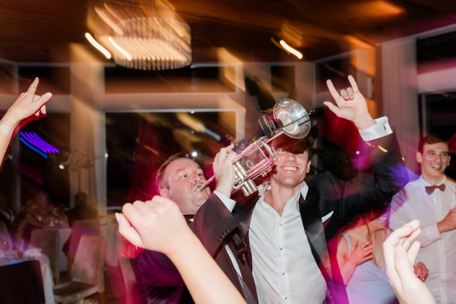 DJ Callum dancing with a couple on their wedding day