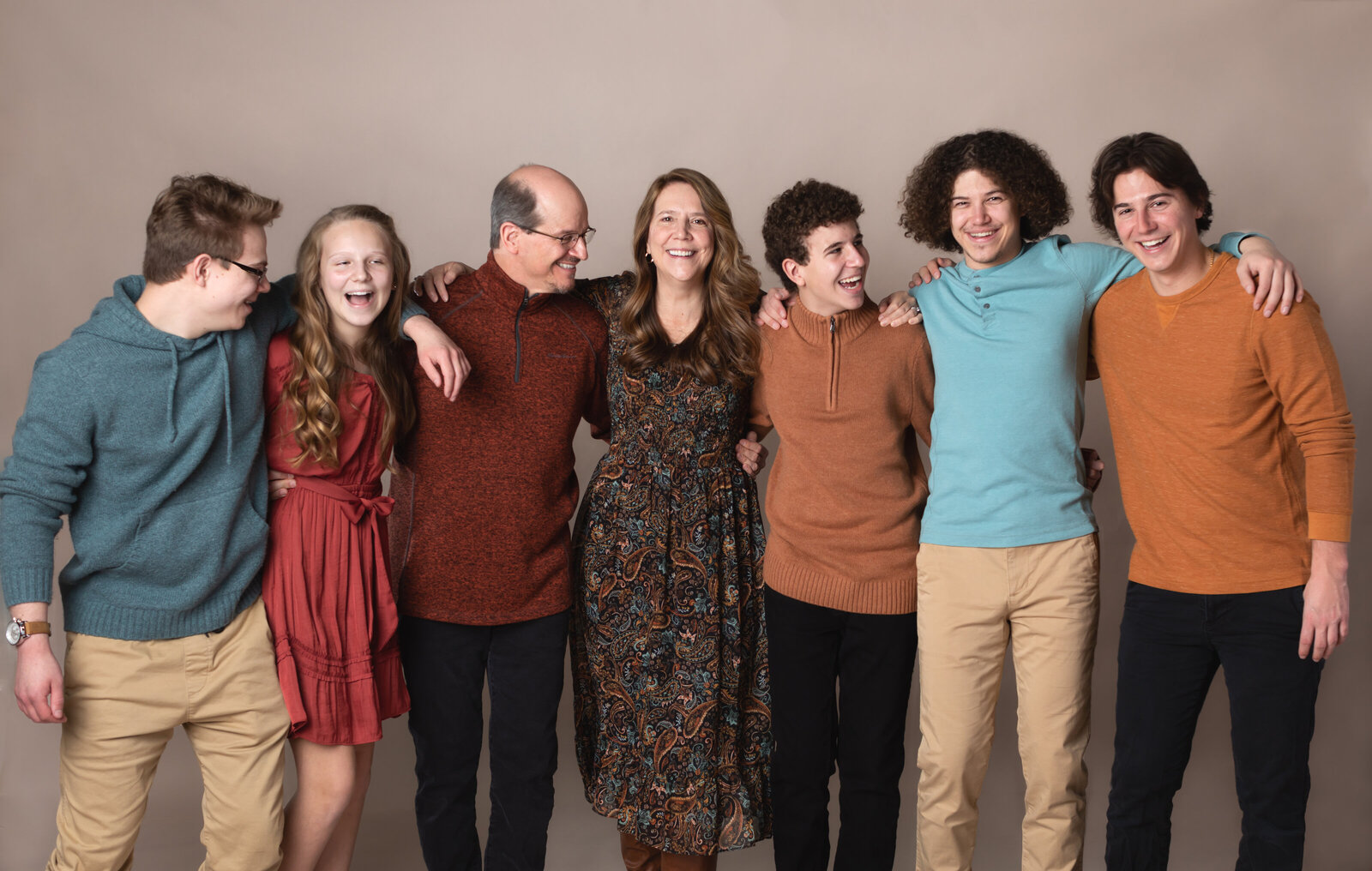 family of seven posed for studio family portraits