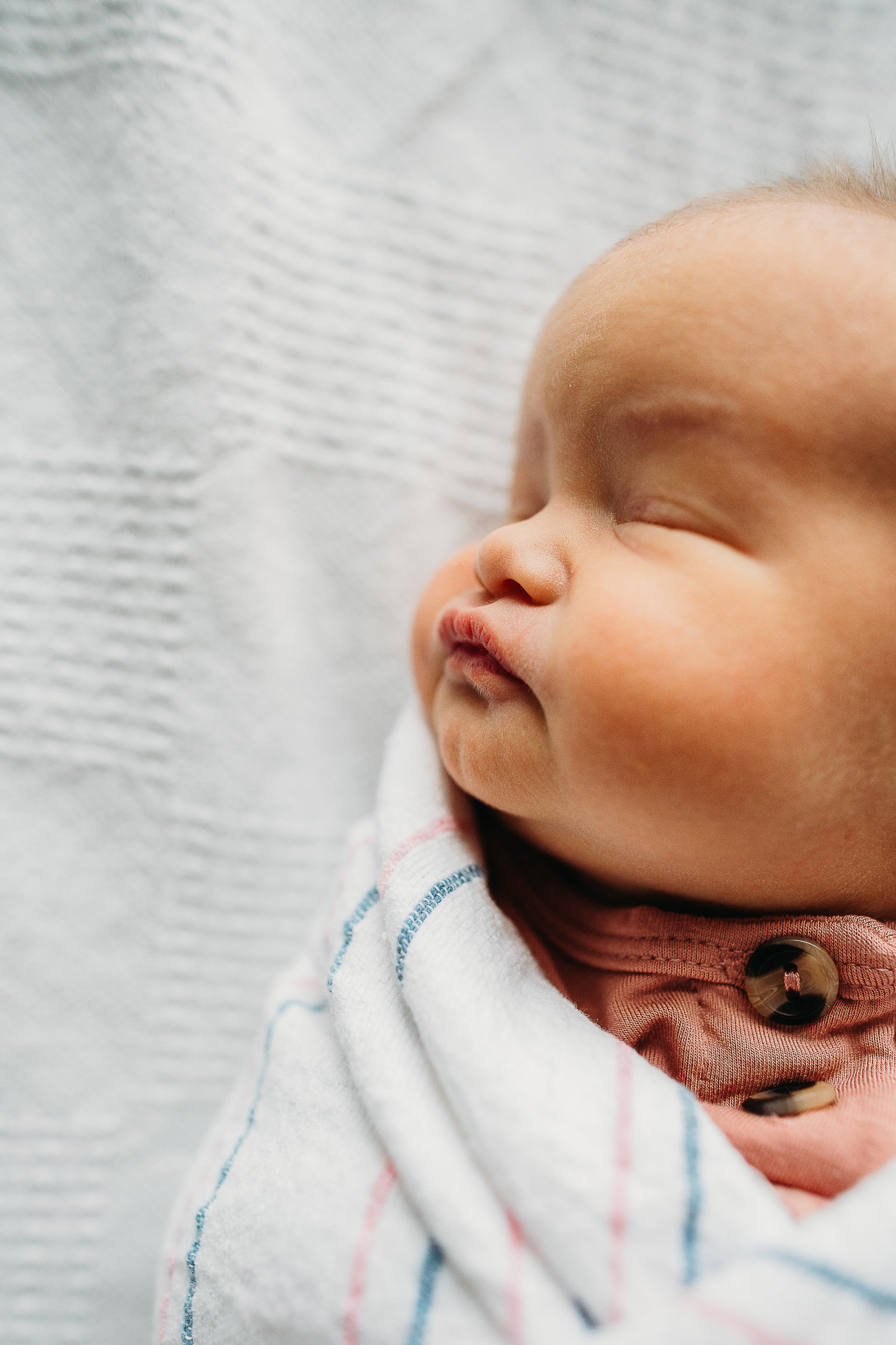 newborn sleeping during hospital photo session in boston ma