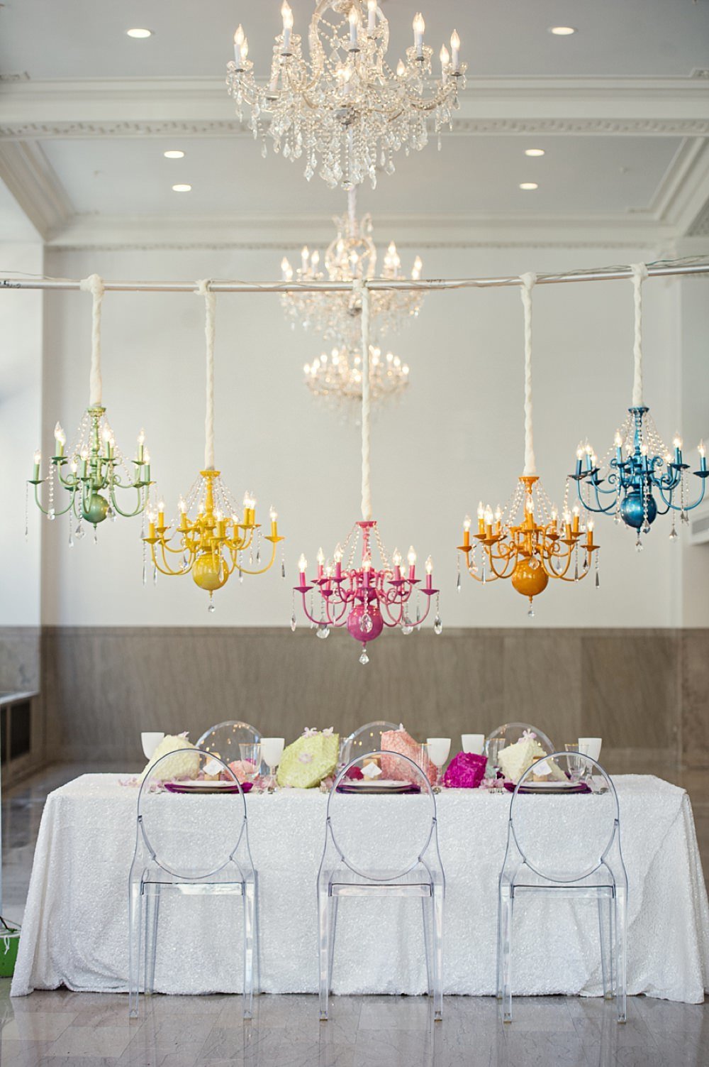 Colorful party tablescape with chandeliers