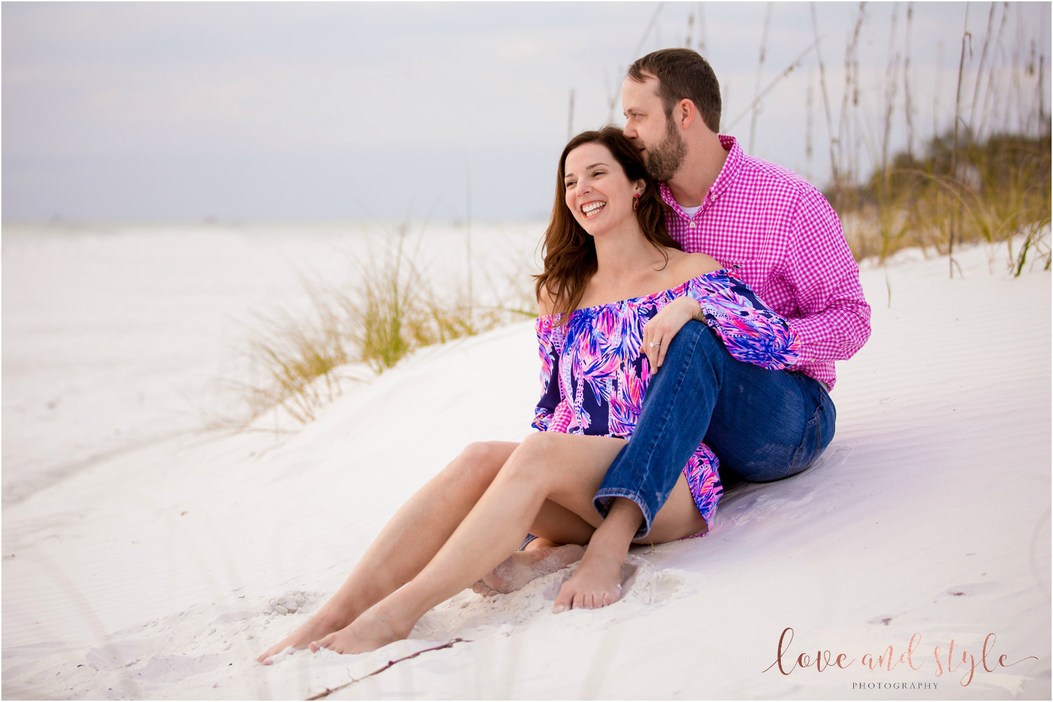 Anna Maria Island Engagement Photography of couple sitting in the sand at sunset on the beach