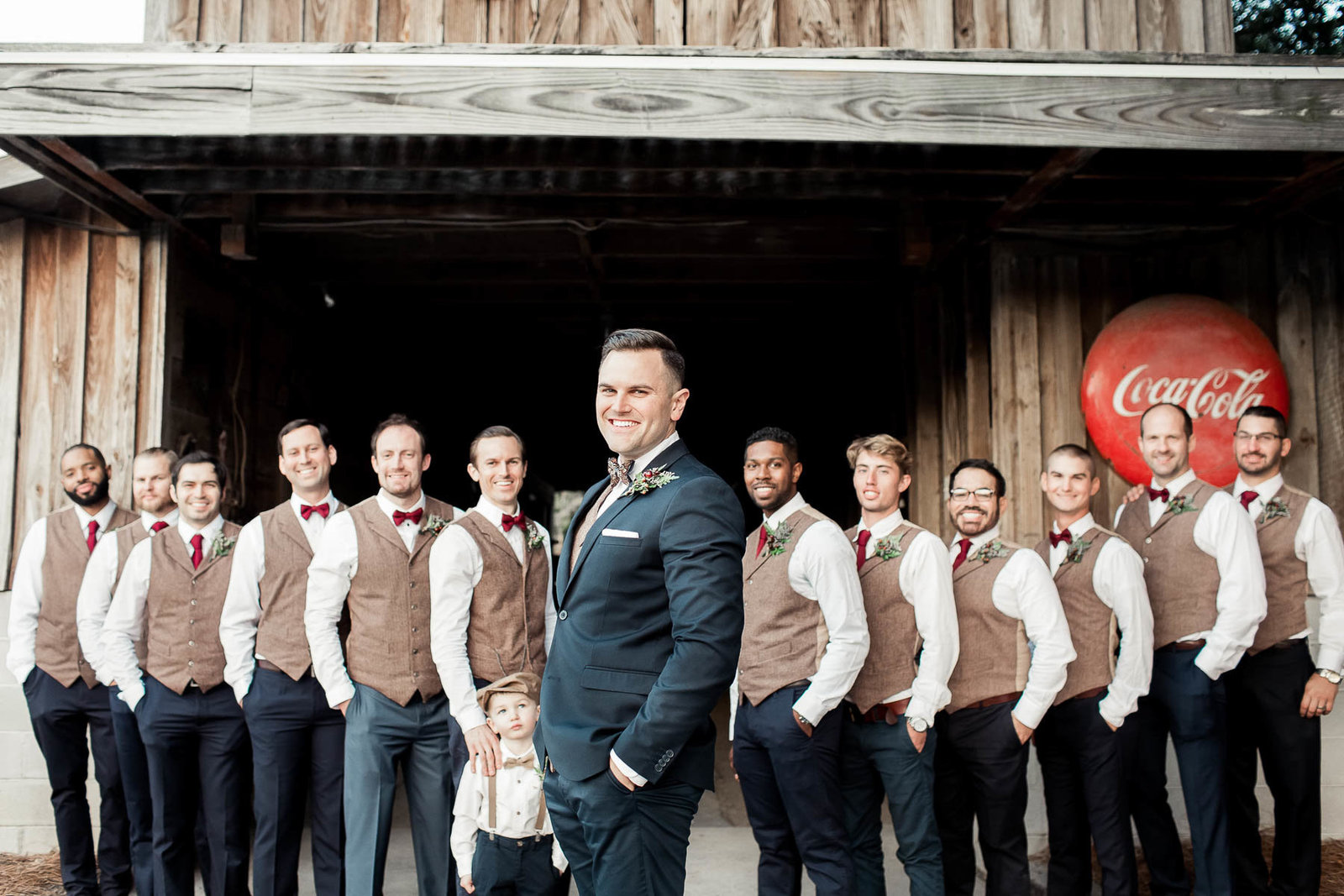Groom poses with groomsmen, Boals Farm, Charleston, South Carolina. Kate Timbers Photography.