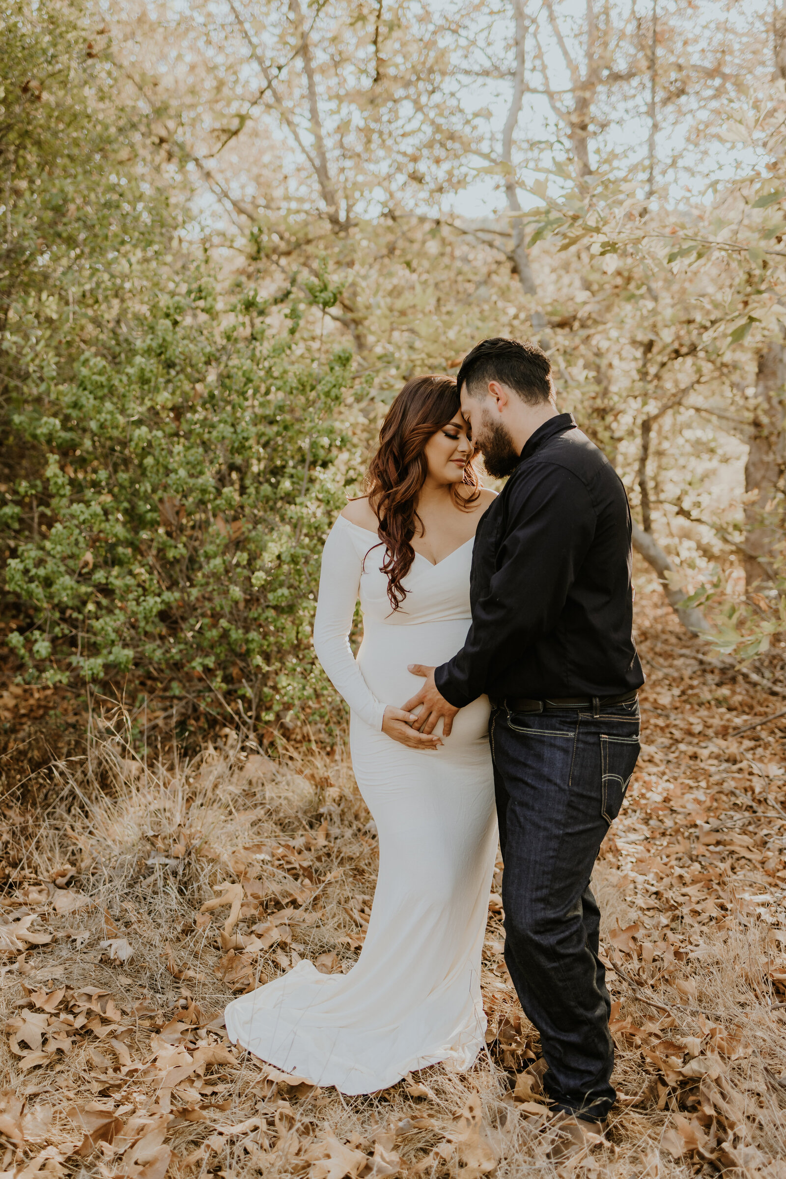 Maternity photo with woman in beautiful dress with her husband Temecula, California Wedding and lifestyle photographer Yescphotography