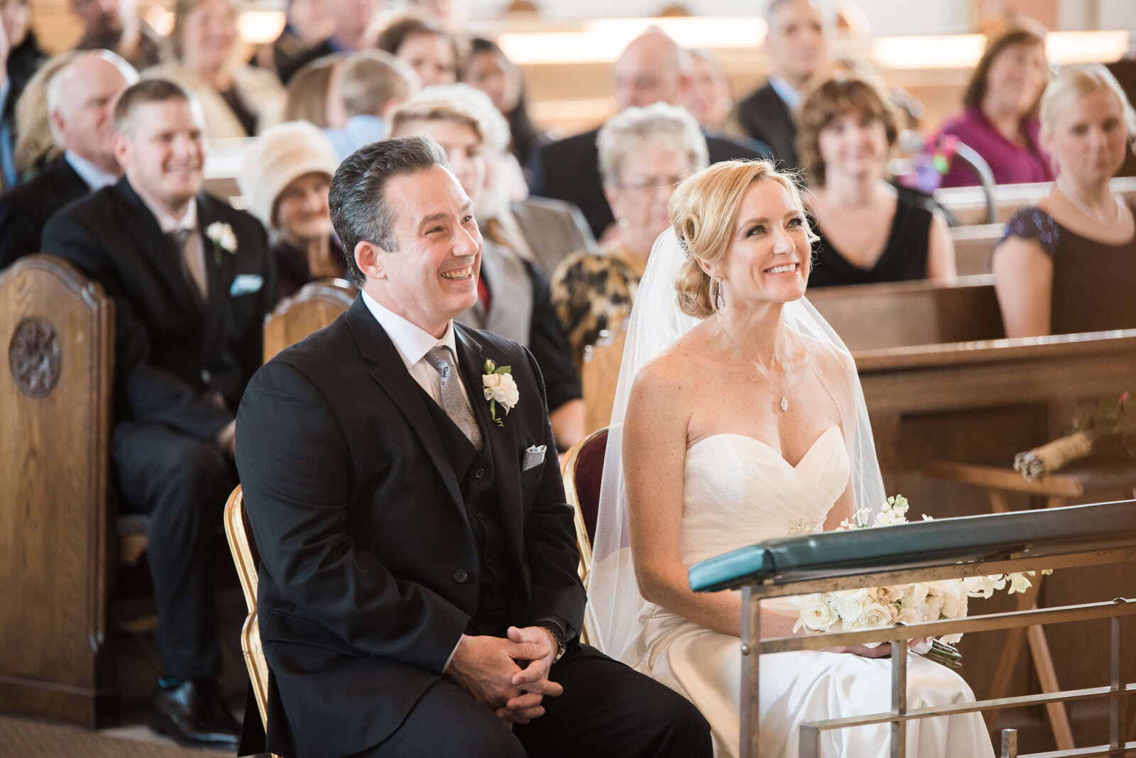 Lisa-and-Mike-wedding-at-Chicago-hotel-couple-smiling-at-ceremony