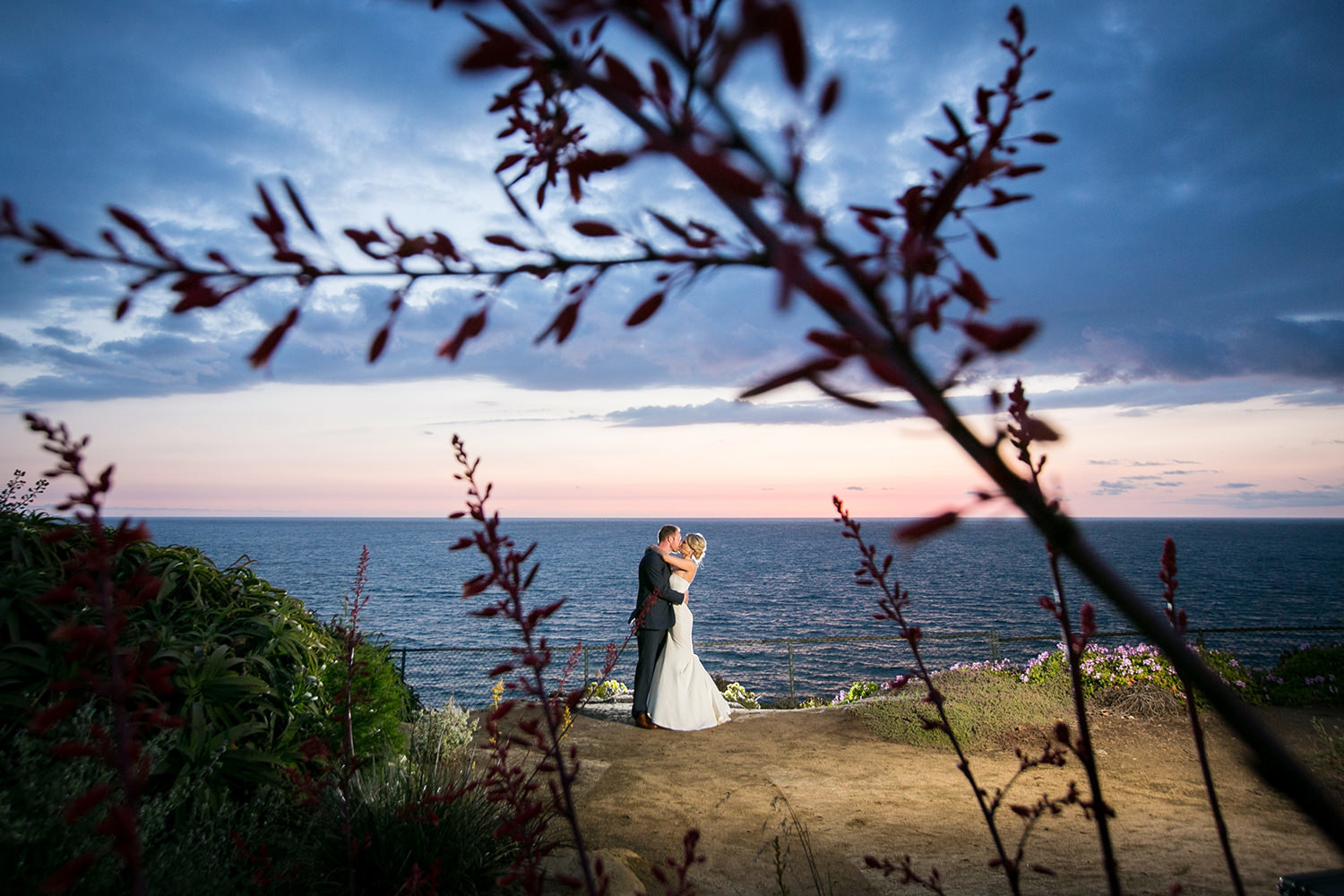 couple looking over the pacific ocean at martin johnson house