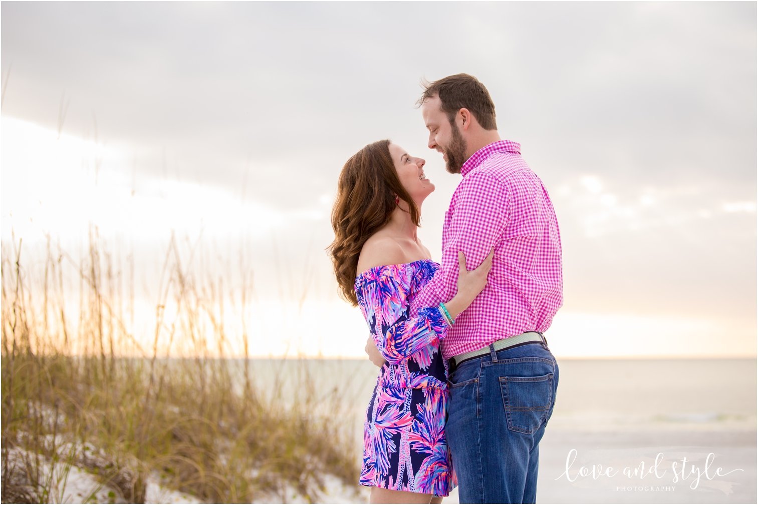 Engagement Photography on Coquina Beach at Sunset with couple embracing on Anna Maria Island