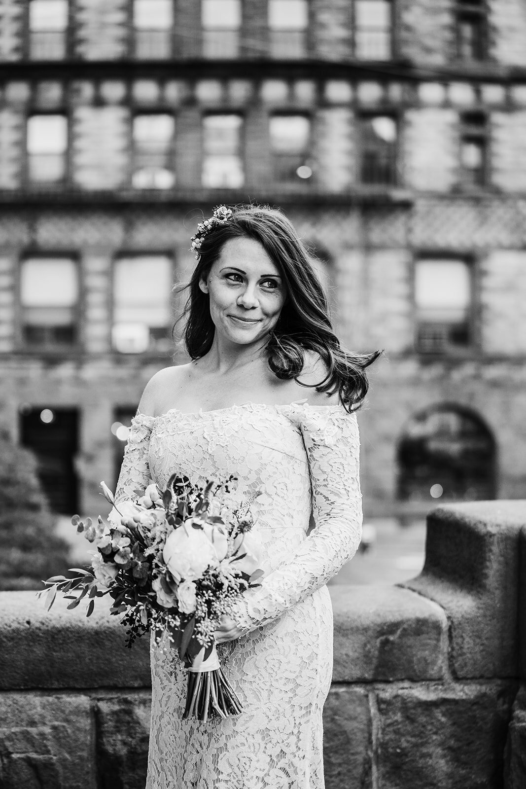 black and white portrait of a bride on her wedding day in the city