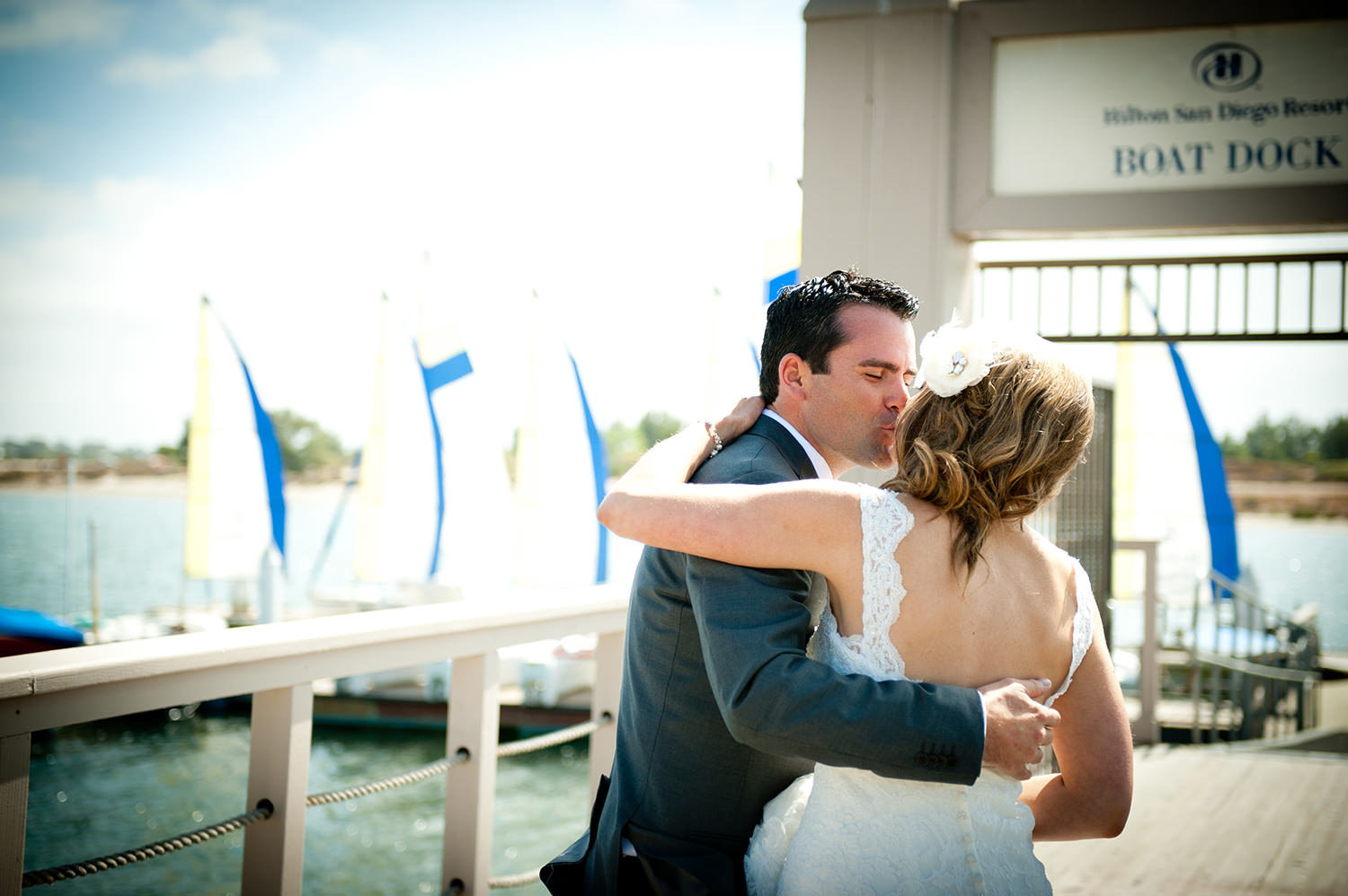bride and groom on bay dock hilton mission bay