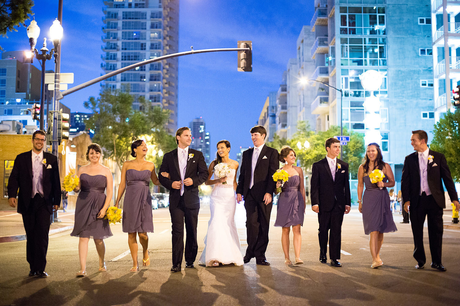 Creative wedding party portrait downtown at night